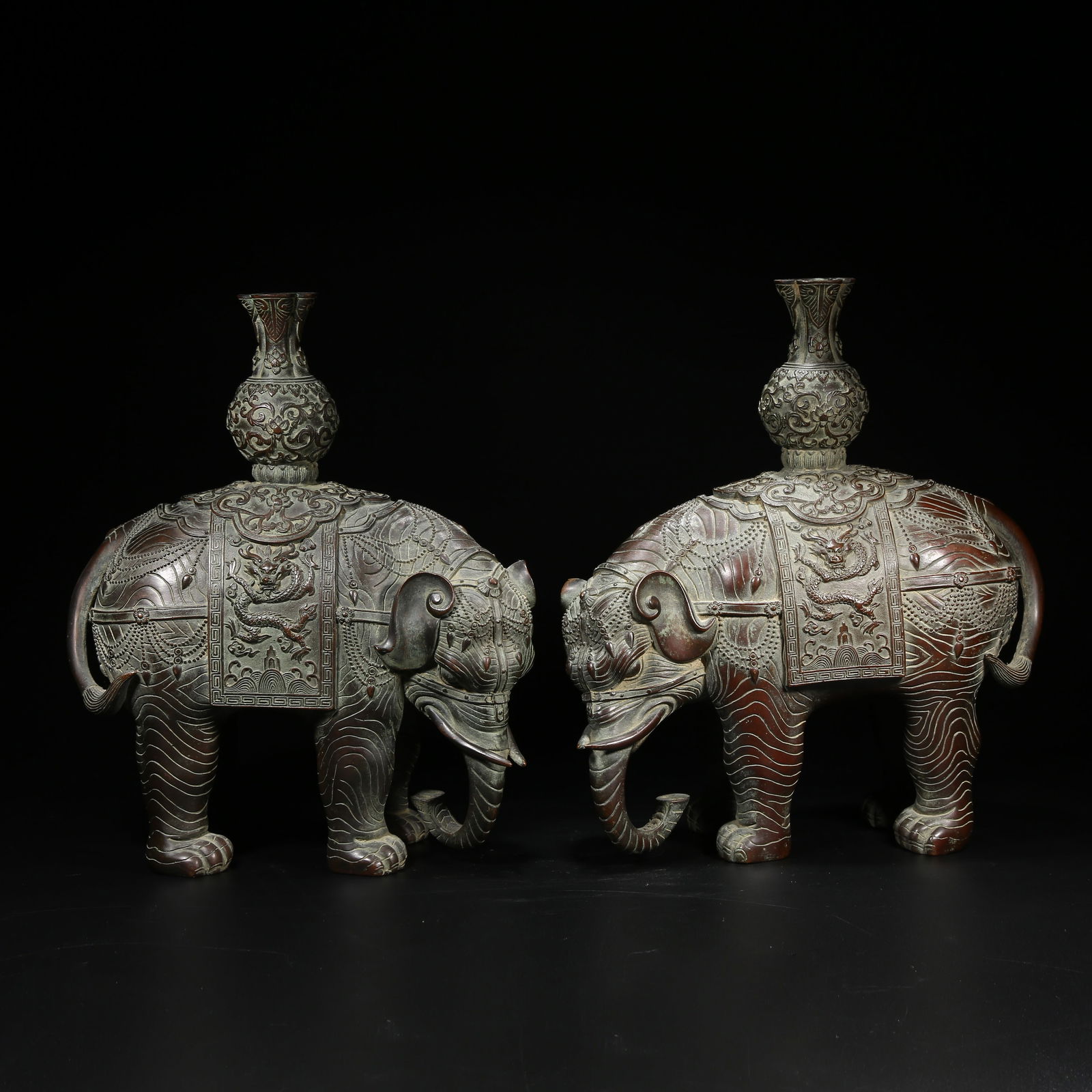 A SET OF BRONZE "PEACEFUL ELEPHANT" INCENSE HOLDERS: Set of bronze "Peaceful Elephant" incense holders
