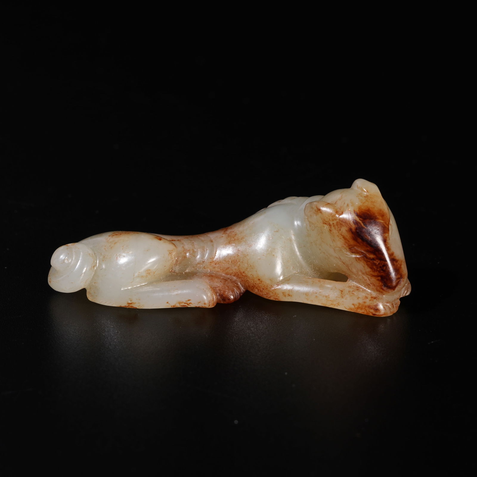 A HETIAN JADE CARVED DOG-SHAPED ORNAMENT (1 of 9)