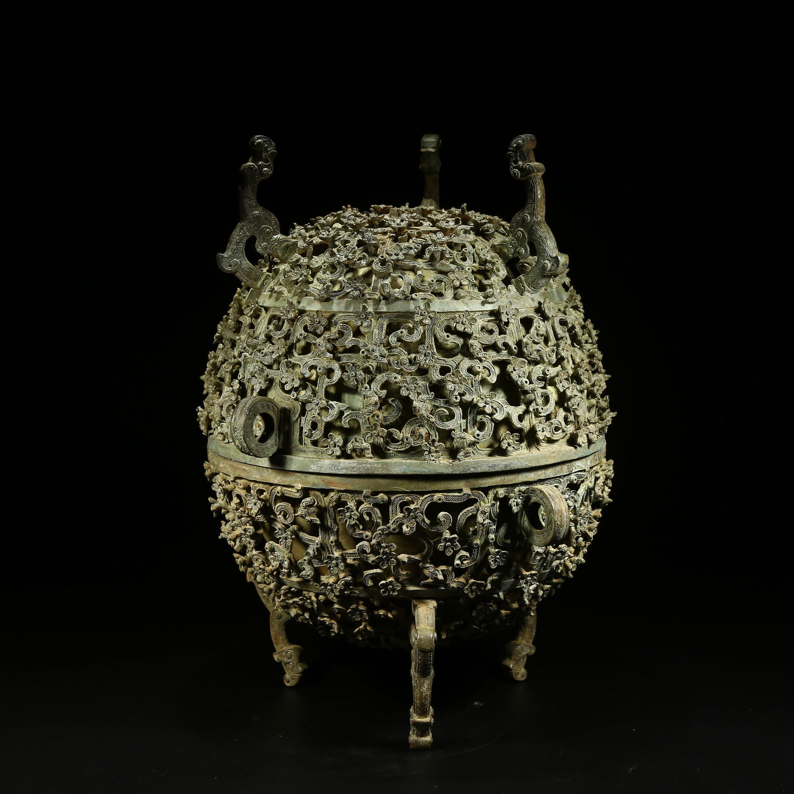 A BRONZE PEDESTAL WITH CHI DRAGON PATTERN: Bronze pedestal with chi dragon pattern