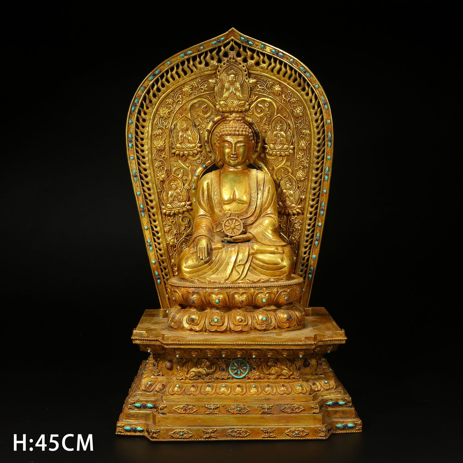 A GILT BRONZE STATUE OF VAIROCANA BUDDHA: Gilt bronze statue of Vairocana Buddha
