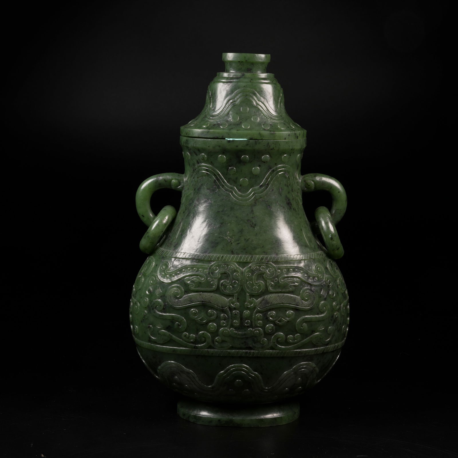 A HETIAN GREEN JADE HUO HUAN COVERED CENSER WITH BEAST-FACE MOTIF: Hetian green jade huo huan covered censer with beast-face motif