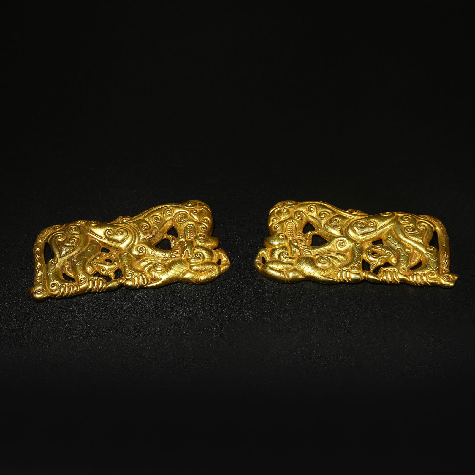 A SET OF GILT BRONZE TIGER BITING DEER PLAQUE ORNAMENTS: Set of gilt bronze tiger biting deer plaque ornaments