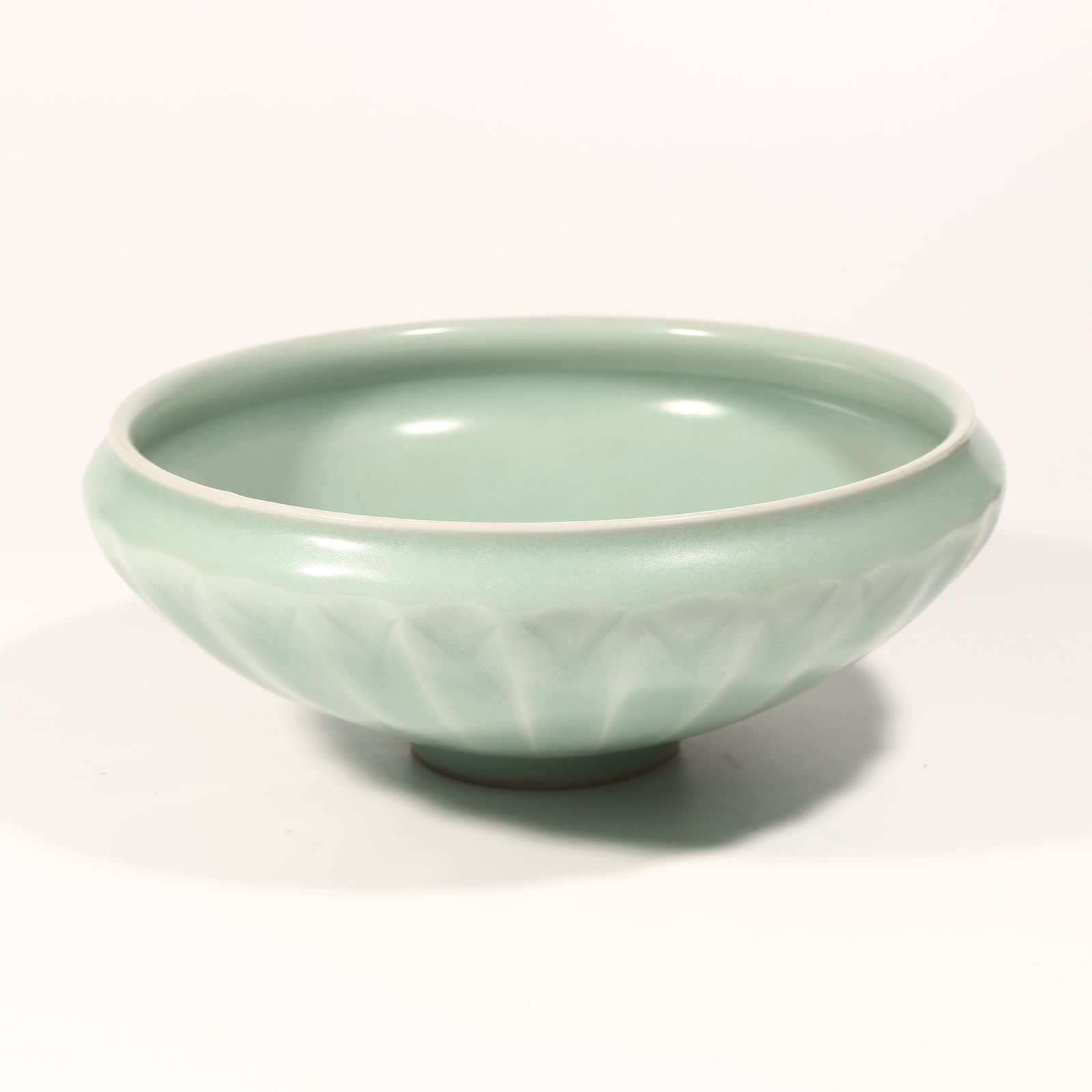 A LONGQUAN KILN CHRYSANTHEMUM-PETAL WATER BASIN: Longquan Kiln Chrysanthemum-Petal Water Basin