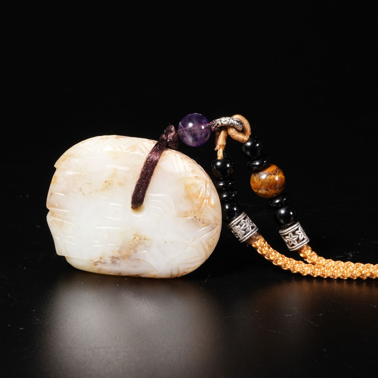 A HETIAN JADE AUSPICIOUS BEAST PENDANT: Hetian Jade Auspicious Beast Pendant