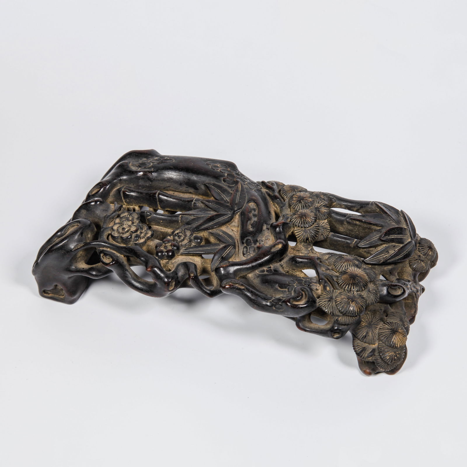 A ZITAN WOOD CARVED PLUM BLOSSOM PATTERN INK REST: Zitan Wood Carved Plum Blossom Pattern Ink Rest