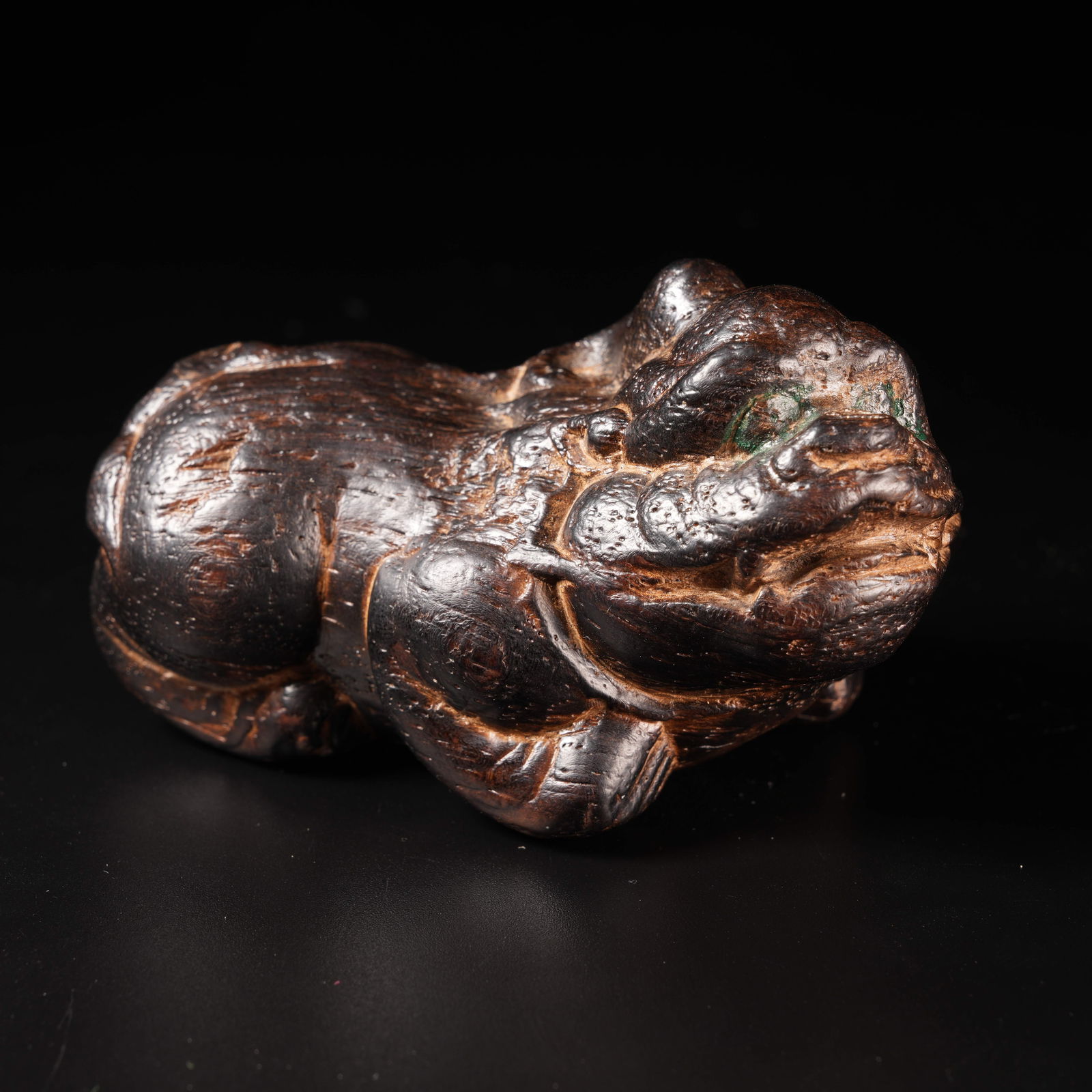 A ZITAN WOOD PAPERWEIGHT WITH AUSPICIOUS BEAST: Zitan Wood Paperweight with Auspicious Beast