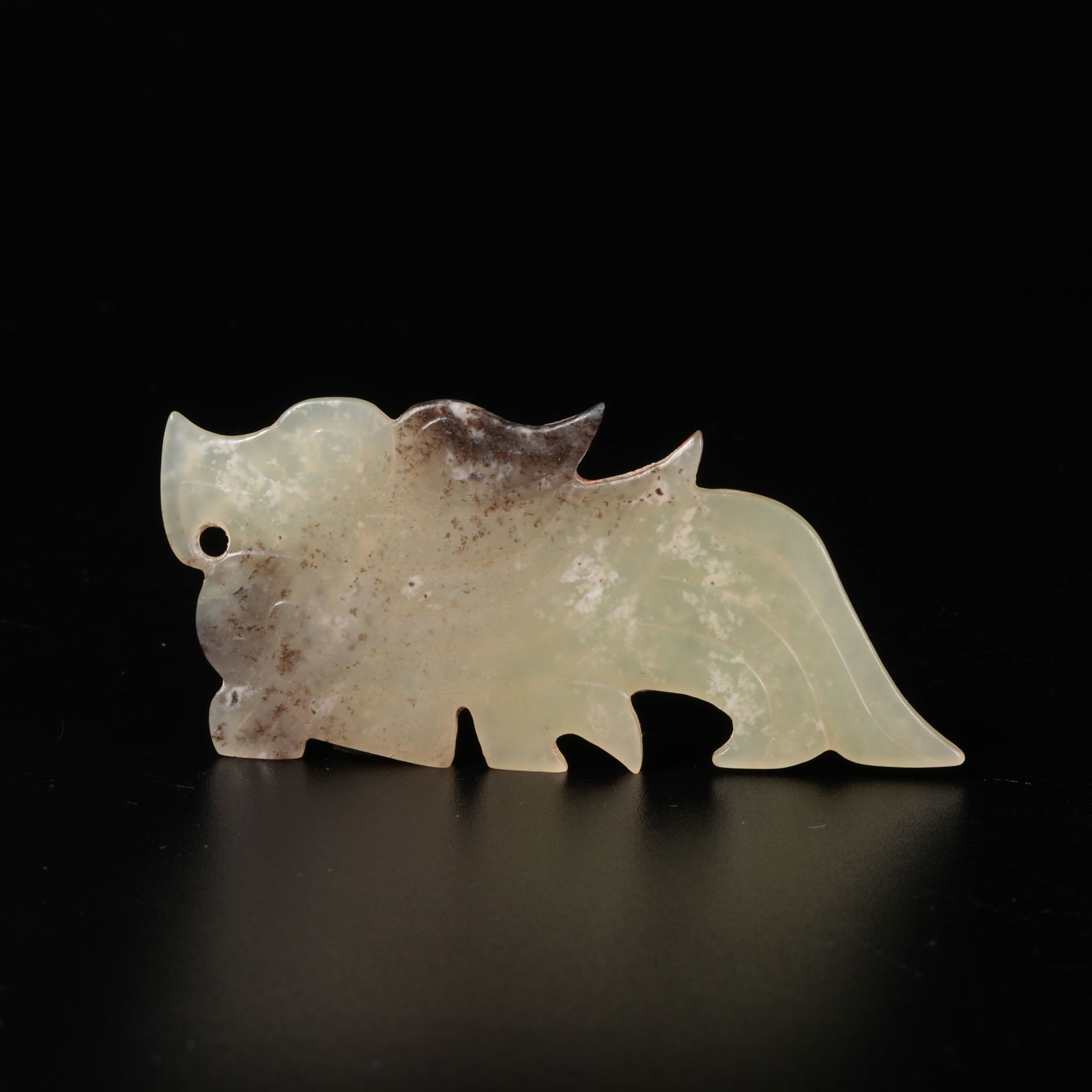 A HETIAN JADE BEAST-SHAPED PENDANT: Hetian Jade Beast-Shaped Pendant