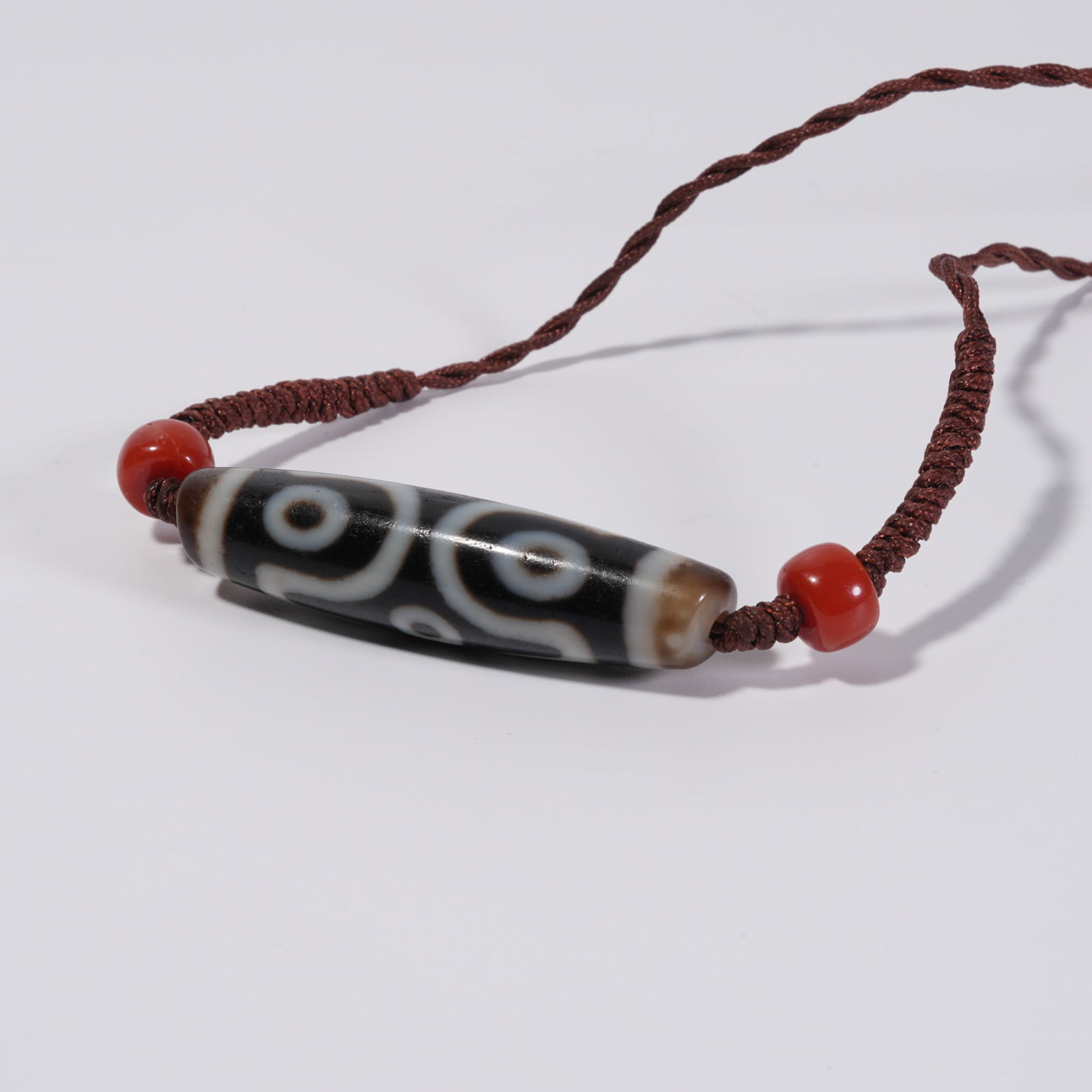 A SIX-EYED TIANZHU BEAD: Six-Eyed Tianzhu Bead