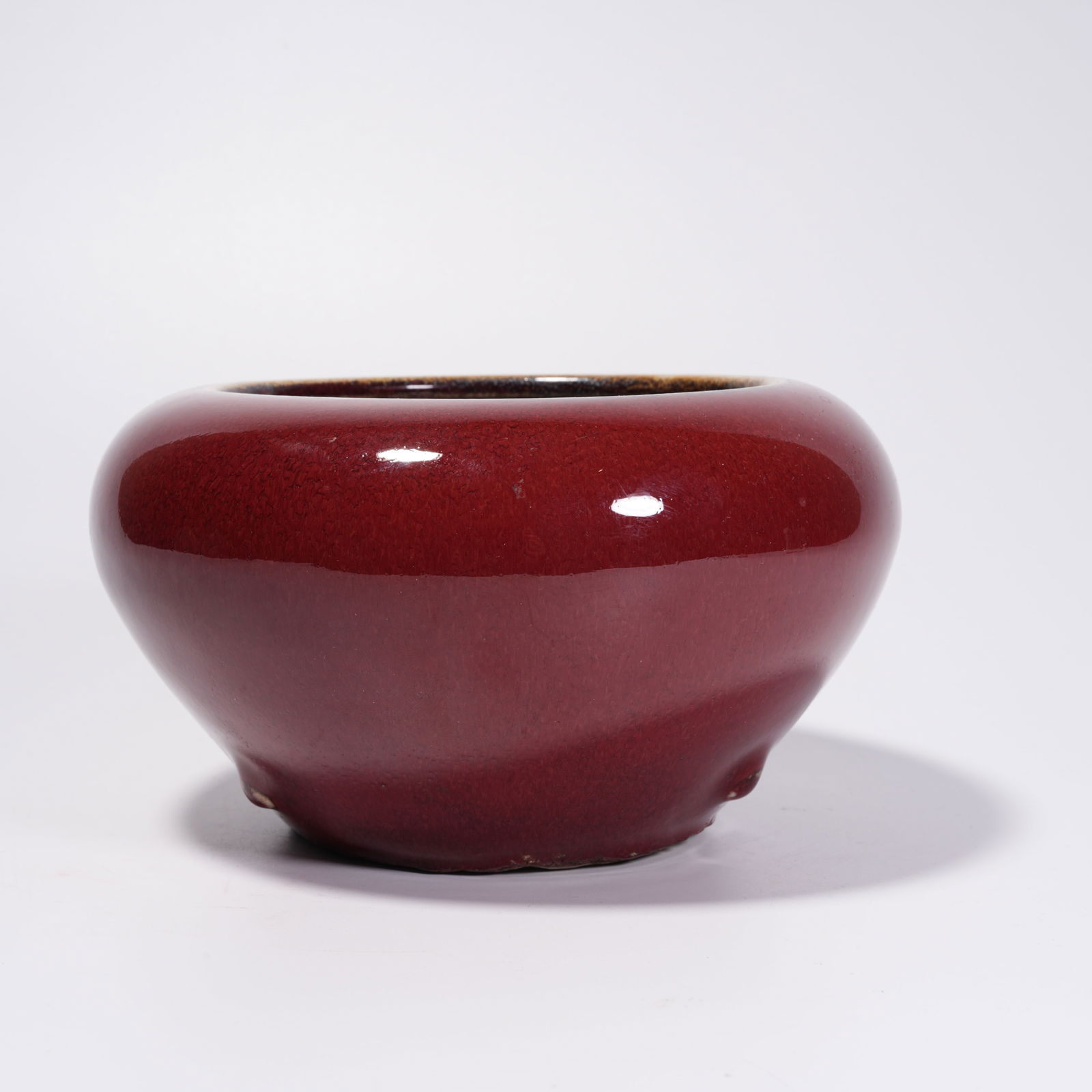 A RED-GLAZED WASH BASIN: Red-Glazed Wash Basin