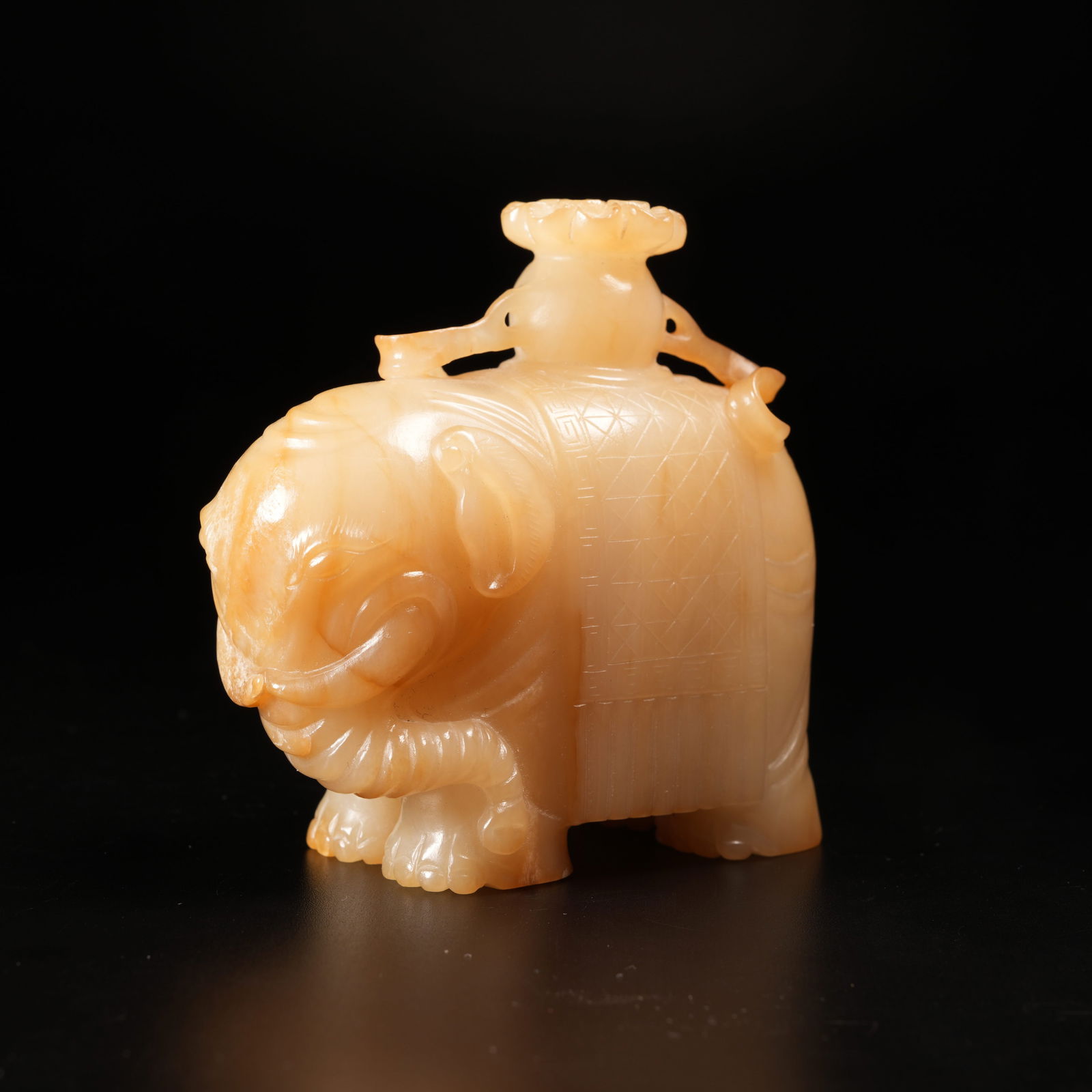 A "PEACE AND PROSPERITY" ELEPHANT ORNAMENT IN ARCHAIC JADE: "Peace and Prosperity" Elephant Ornament in Archaic Jade