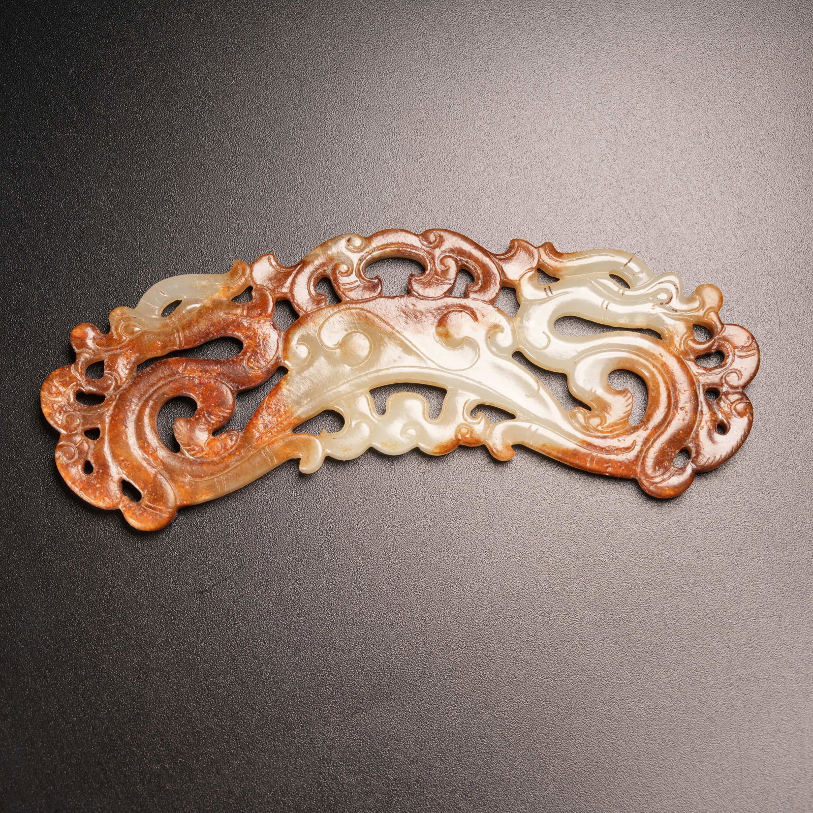 A DRAGON-PATTERN HUANG PENDANT IN ARCHAIC JADE (1 of 9)
