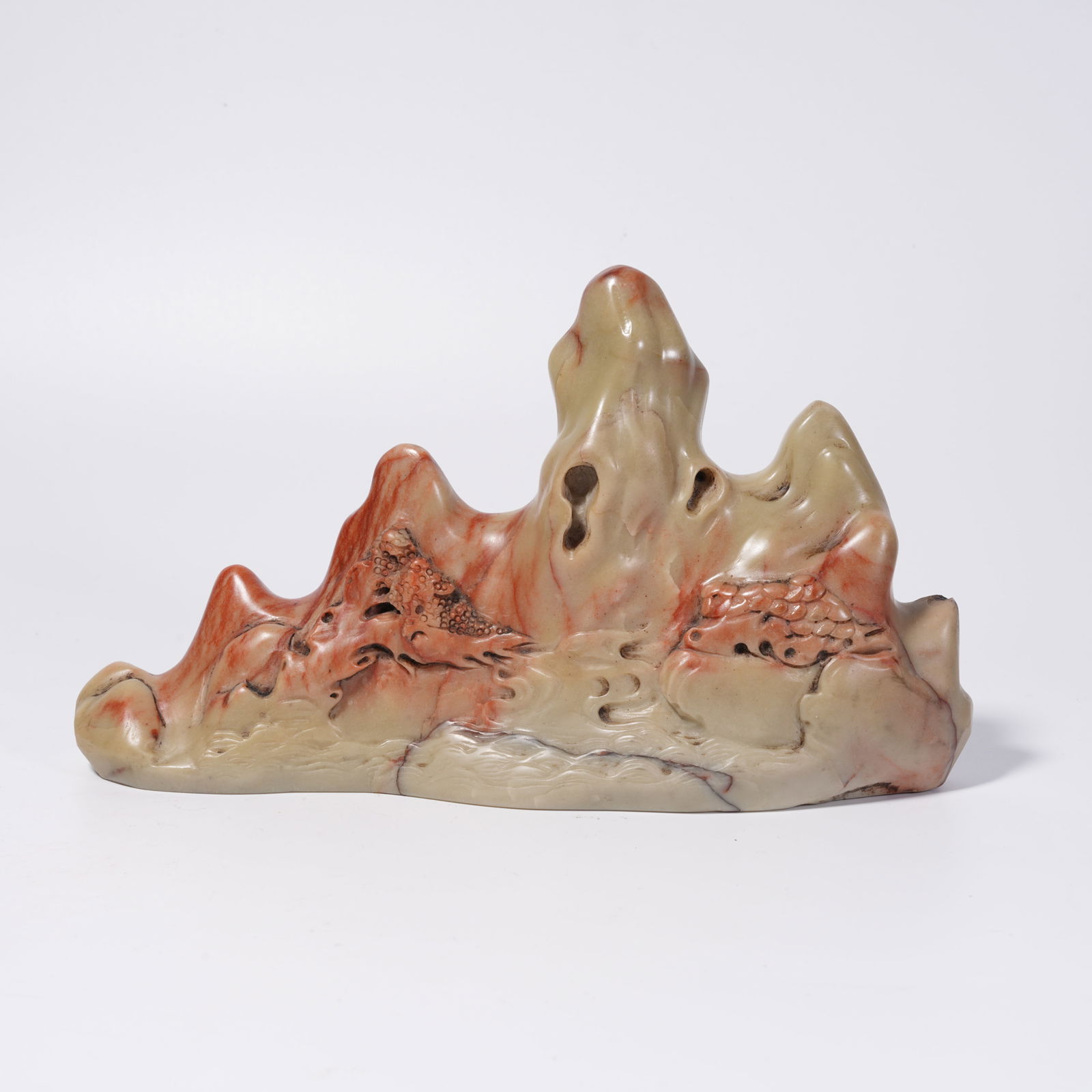 A SHOUSHAN STONE LANDSCAPE-FORM BRUSH REST: Shoushan Stone Landscape-Form Brush Rest