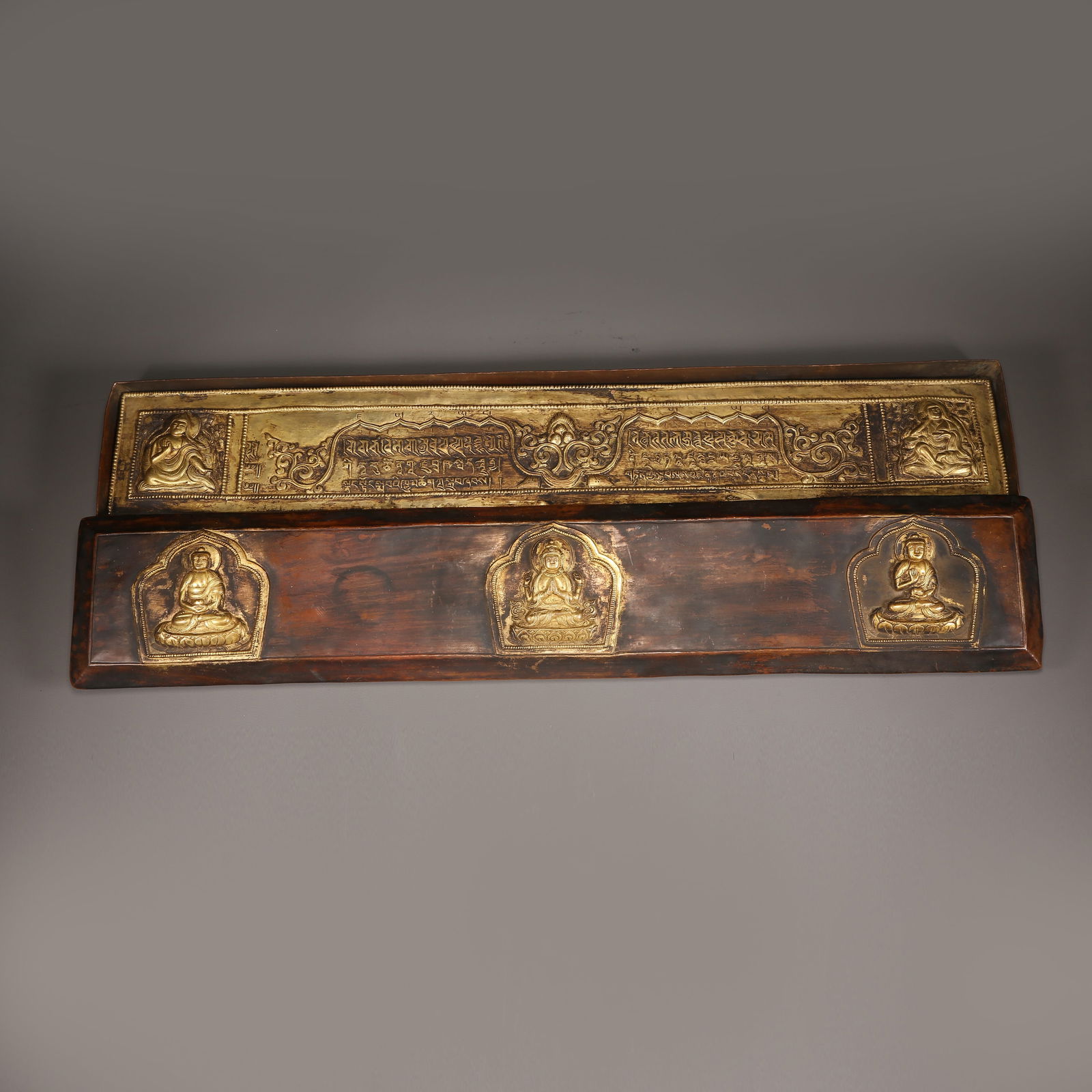 A GILT BRONZE SUTRA IN A CASE: Gilt Bronze Sutra in a Case