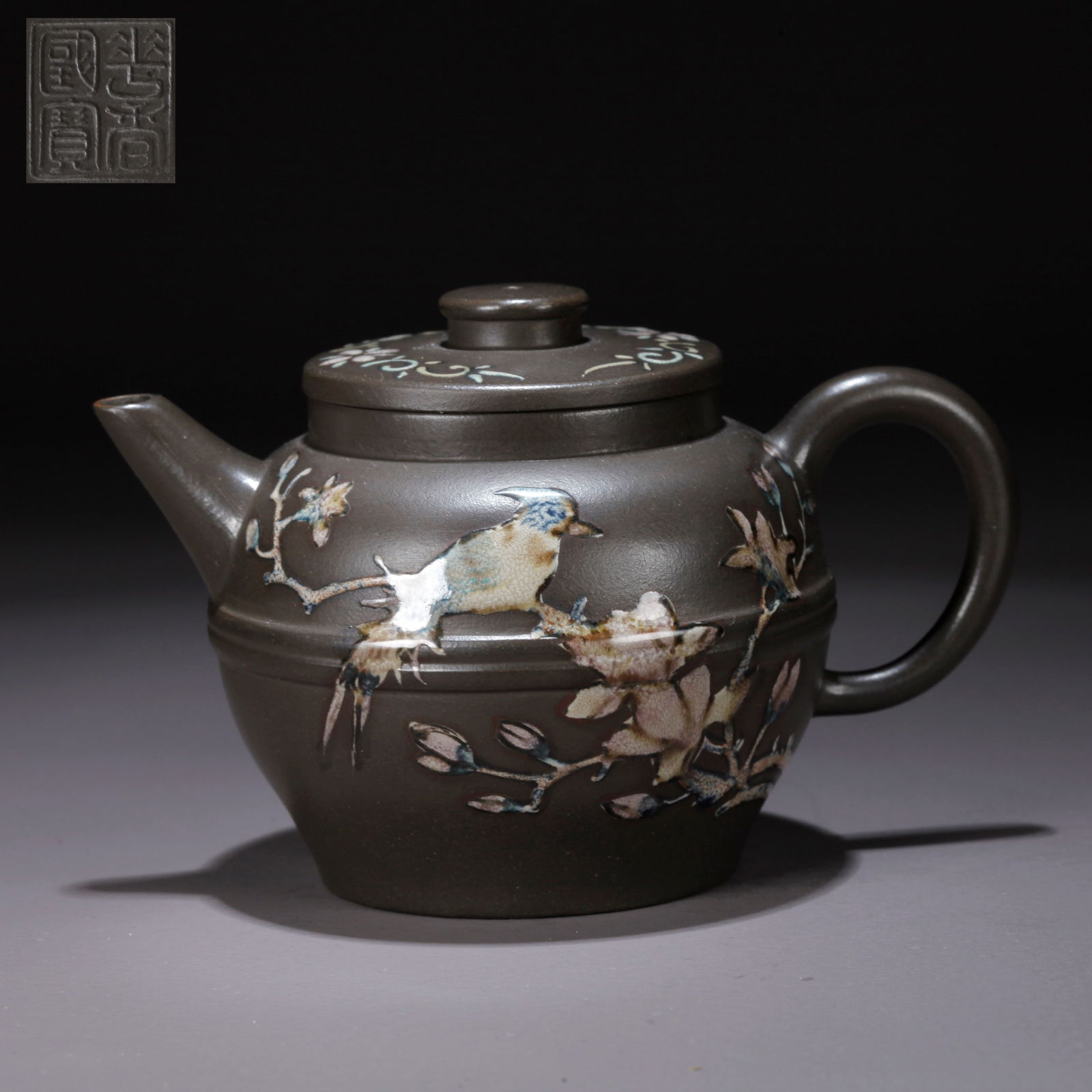 A PURPLE CLAY (ZISHA) FLORAL-AND-BIRD TEAPOT: Purple Clay (Zisha) Floral-and-Bird Teapot