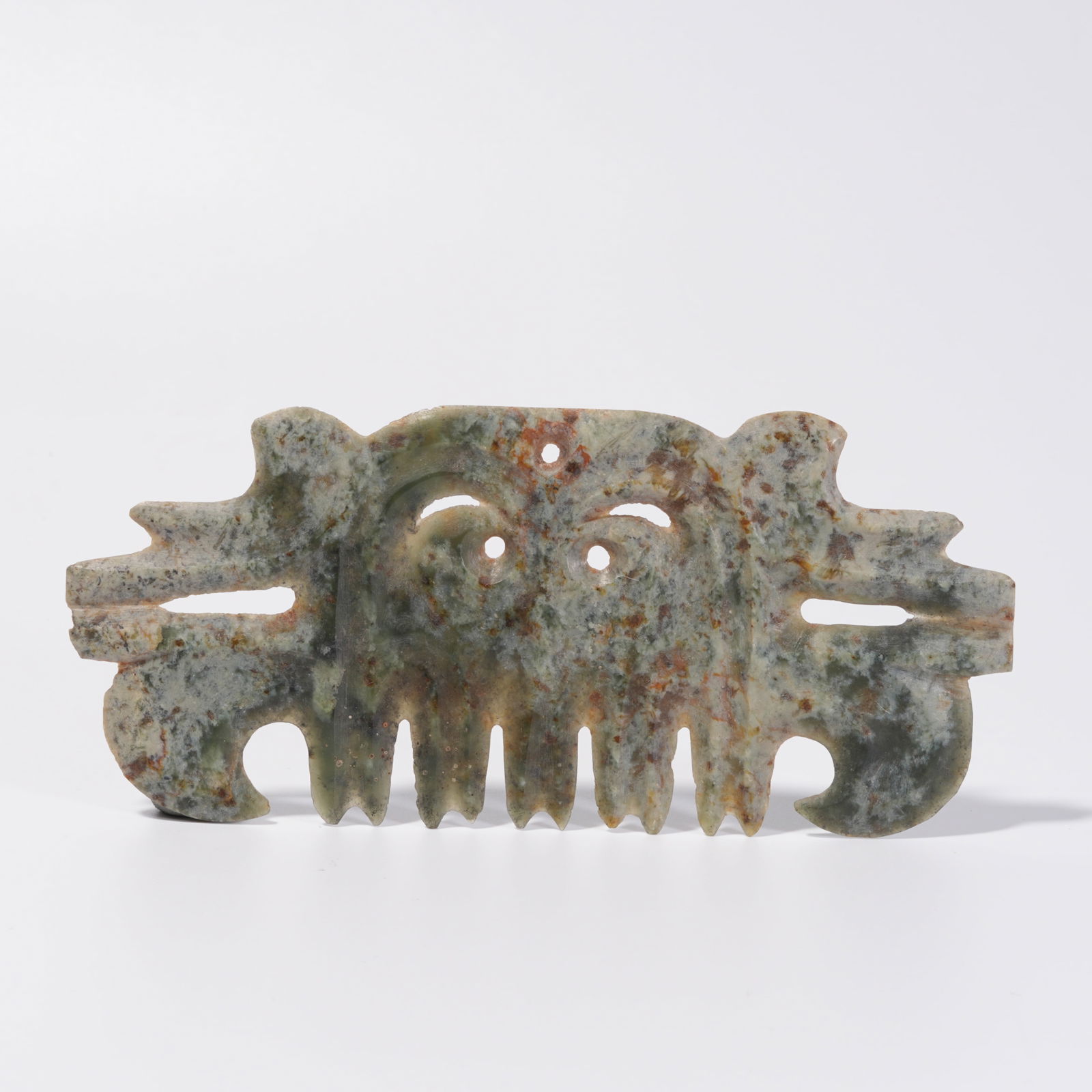 A HONGSHAN JADE HOOK-AND-CLOUD PENDANT: Hongshan Jade Hook-and-Cloud Pendant