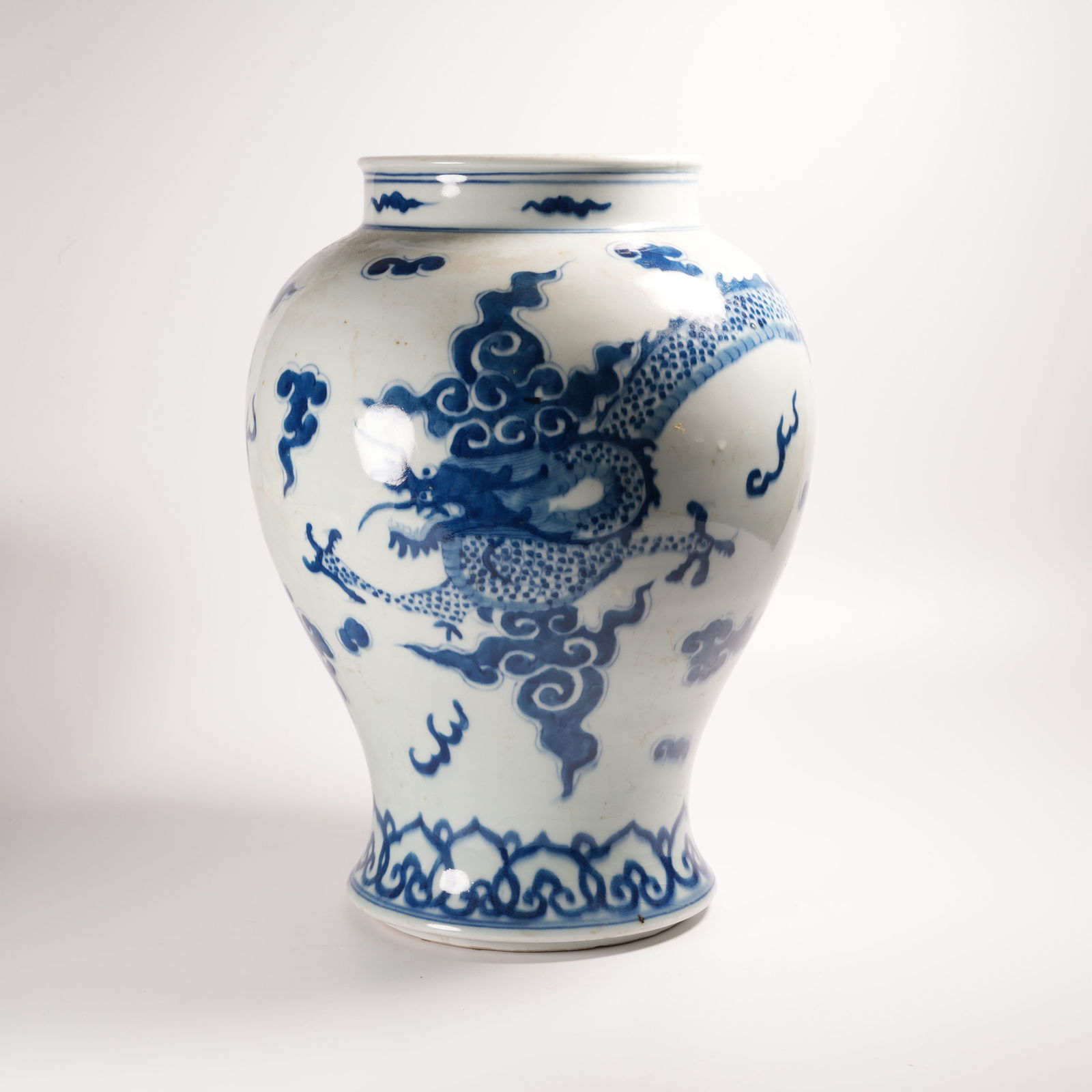 A BLUE-AND-WHITE JAR WITH CLOUD AND DRAGON PATTERN (1 of 9)