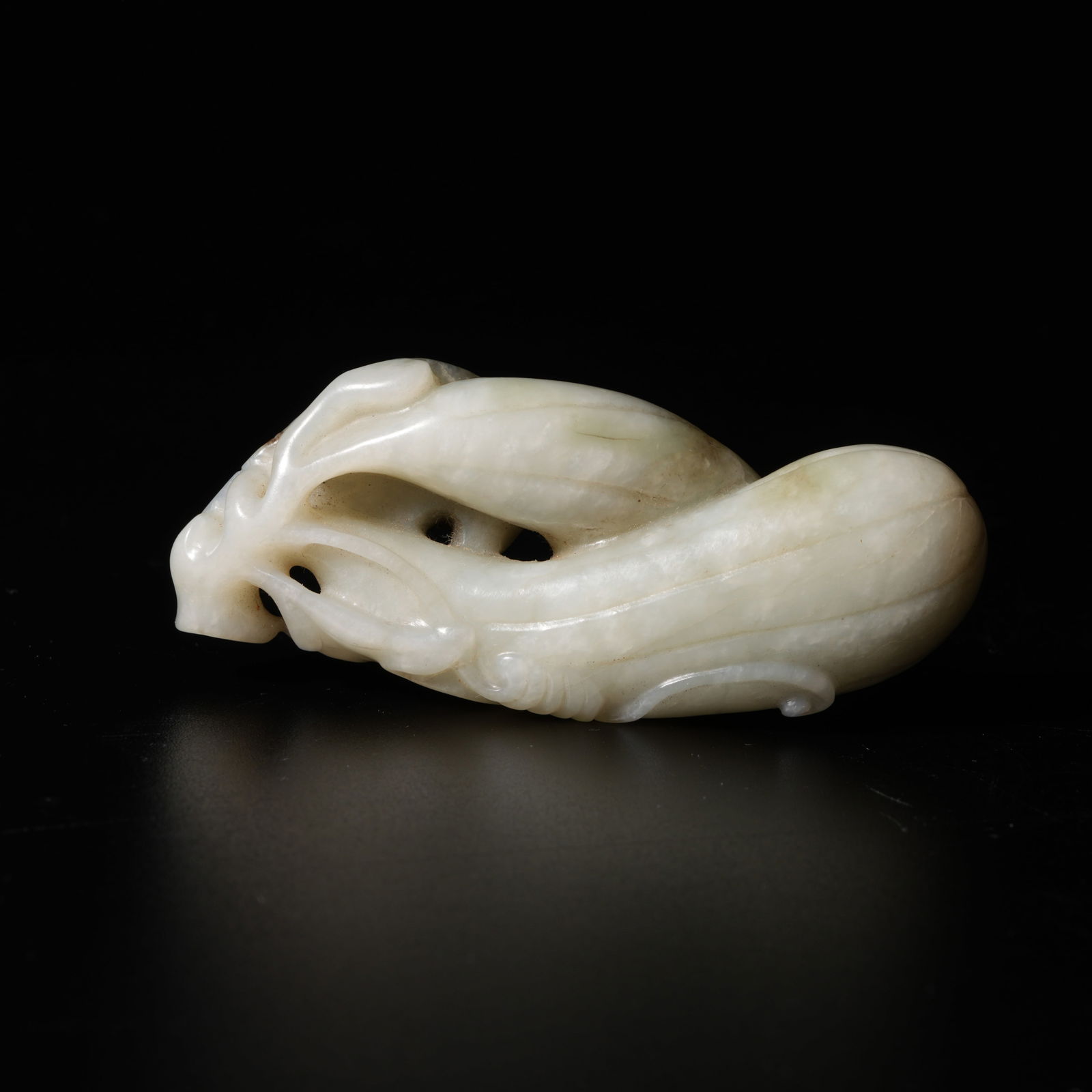 A HETIAN JADE FRUIT-SHAPED PENDANT (1 of 9)