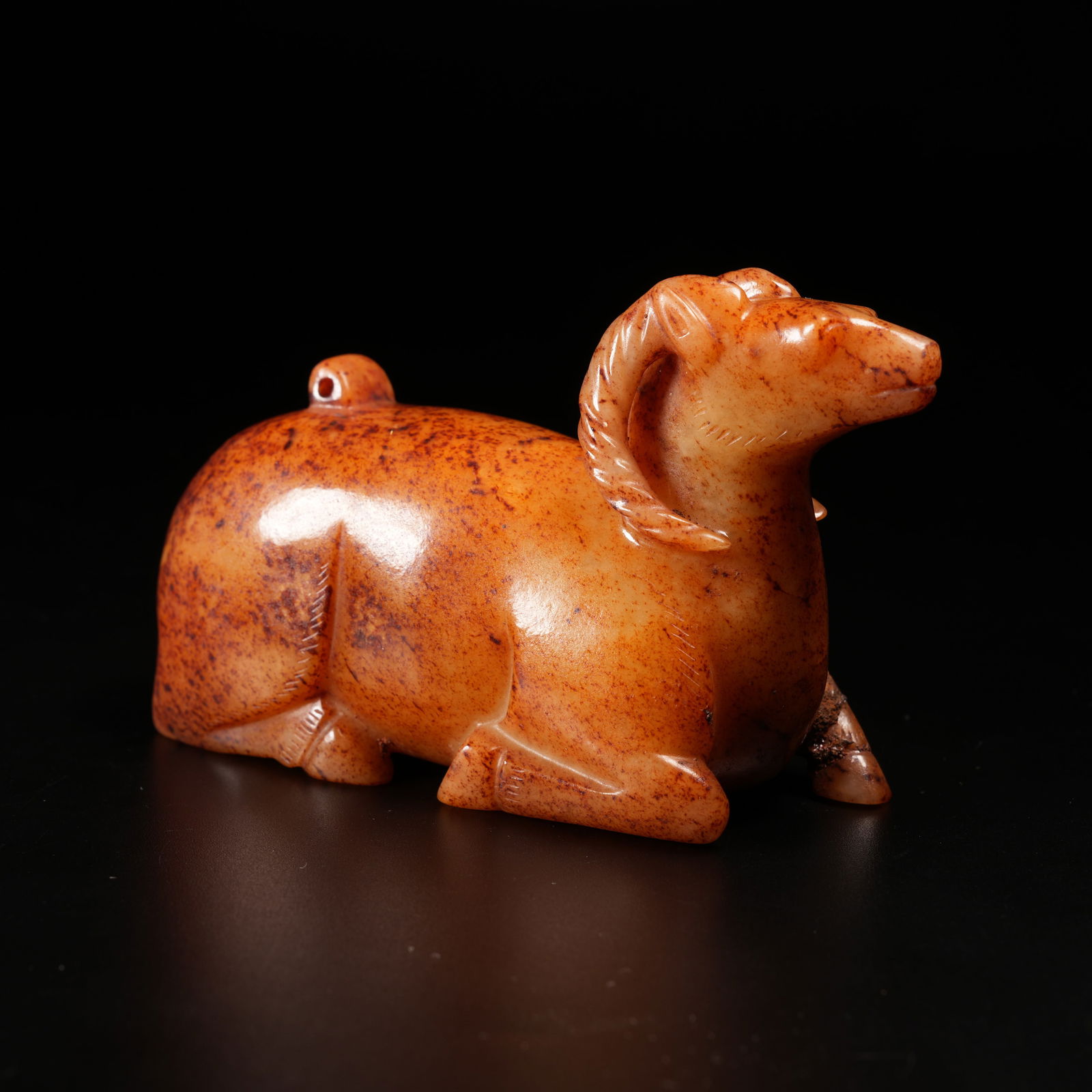 A RECLINING SHEEP ORNAMENT IN ARCHAIC JADE: Reclining Sheep Ornament in Archaic Jade