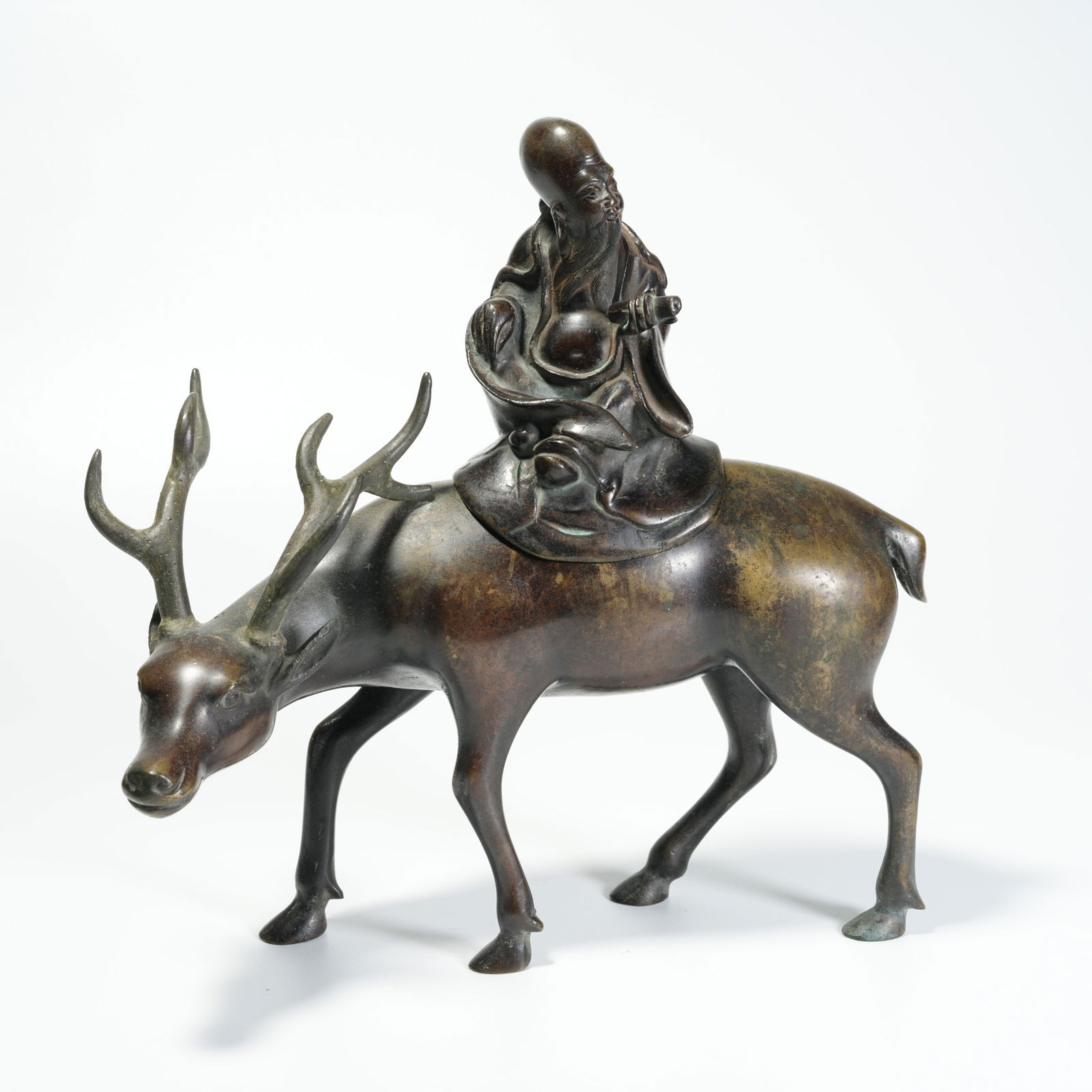 A BRONZE SHOU XING (LONGEVITY STAR) ORNAMENT: Bronze Shou Xing (Longevity Star) Ornament