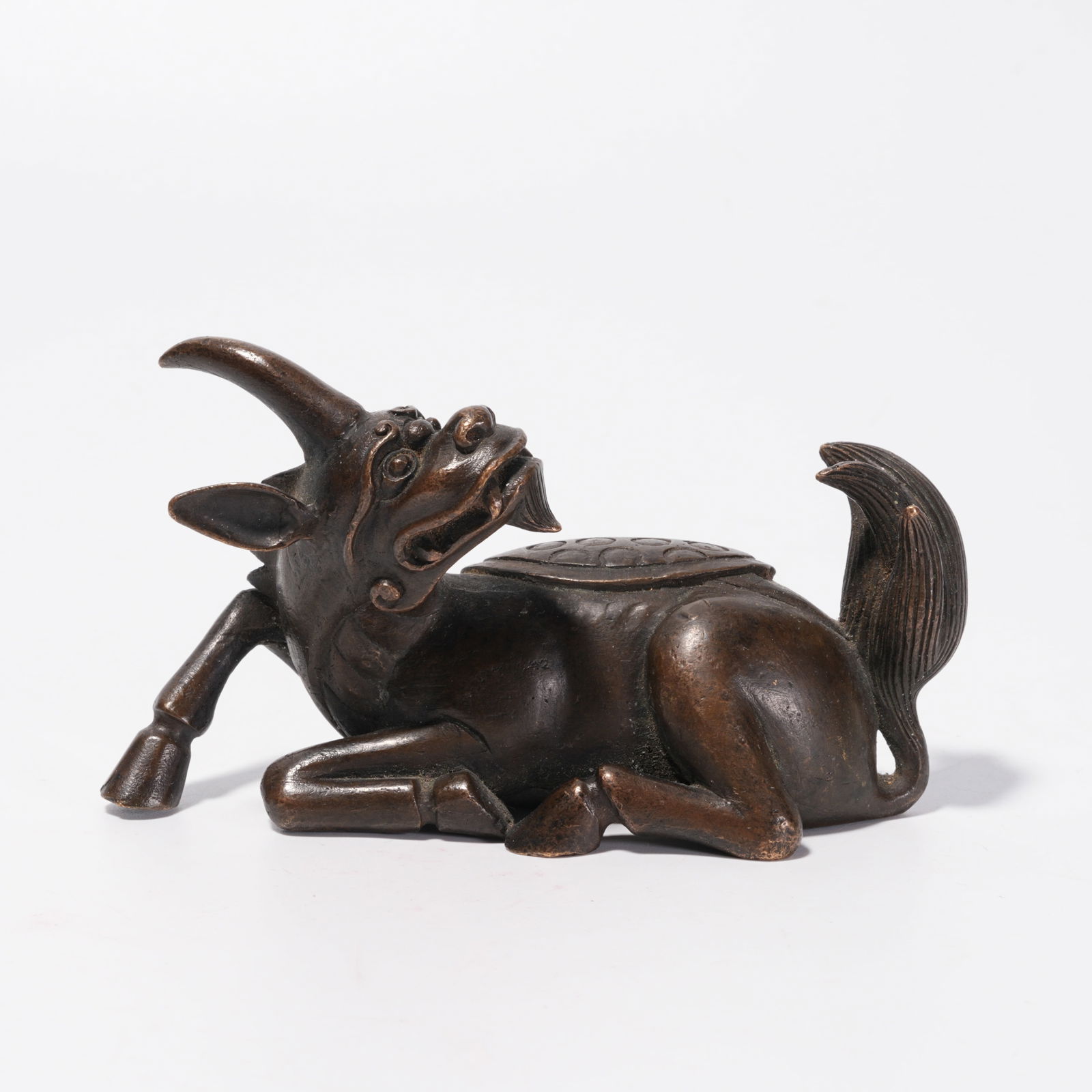 A BRONZE BEAST ORNAMENT: Bronze Beast Ornament