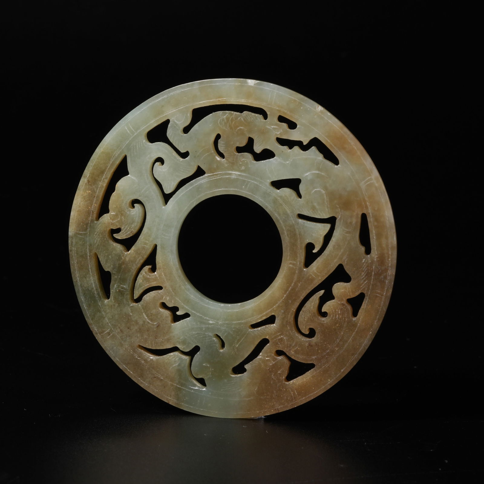 A HETIAN JADE OPENWORK DRAGON PENDANT (1 of 9)