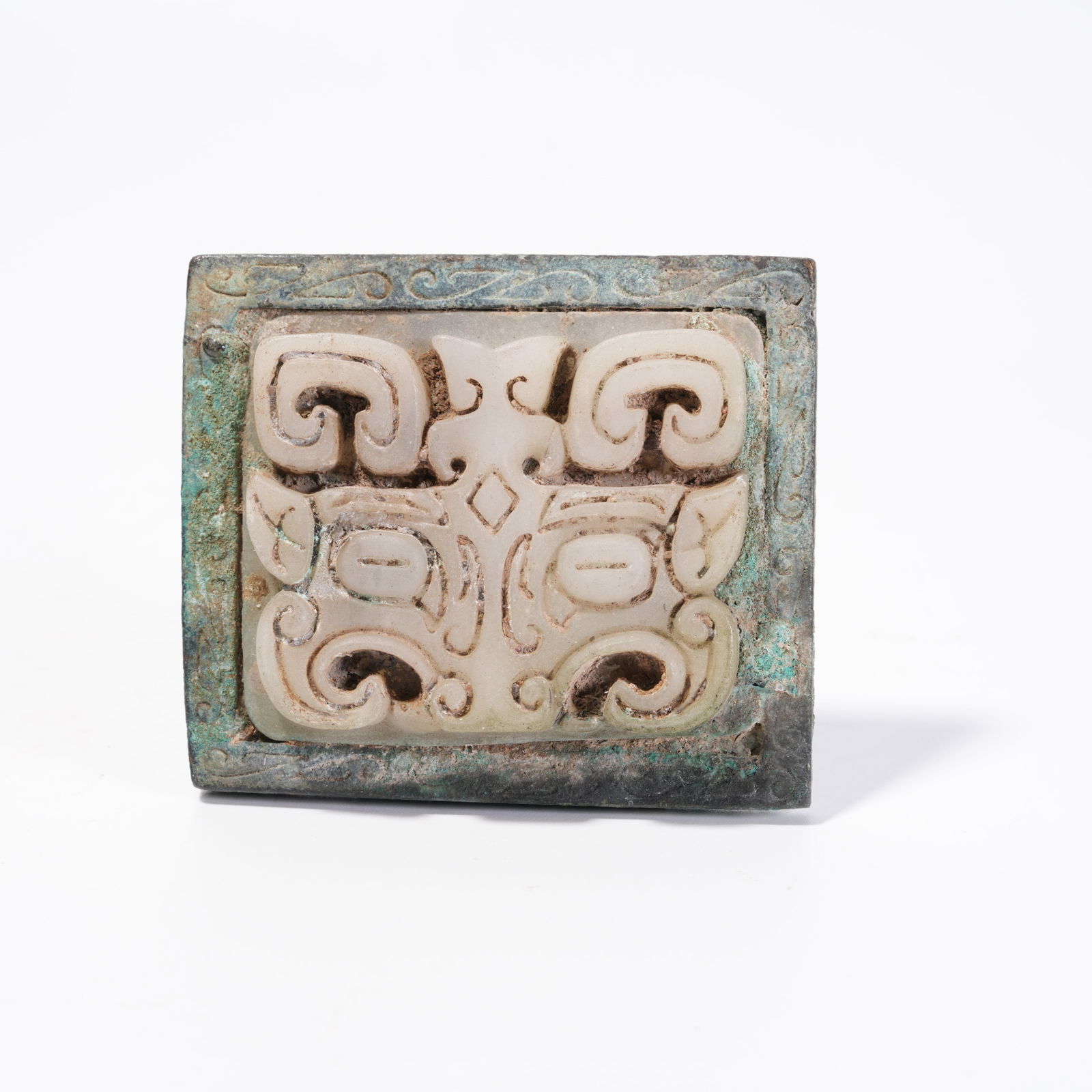 A BRONZE BELT PLATE WITH BEAST-FACE PATTERN: Bronze Belt Plate with Beast-Face Pattern