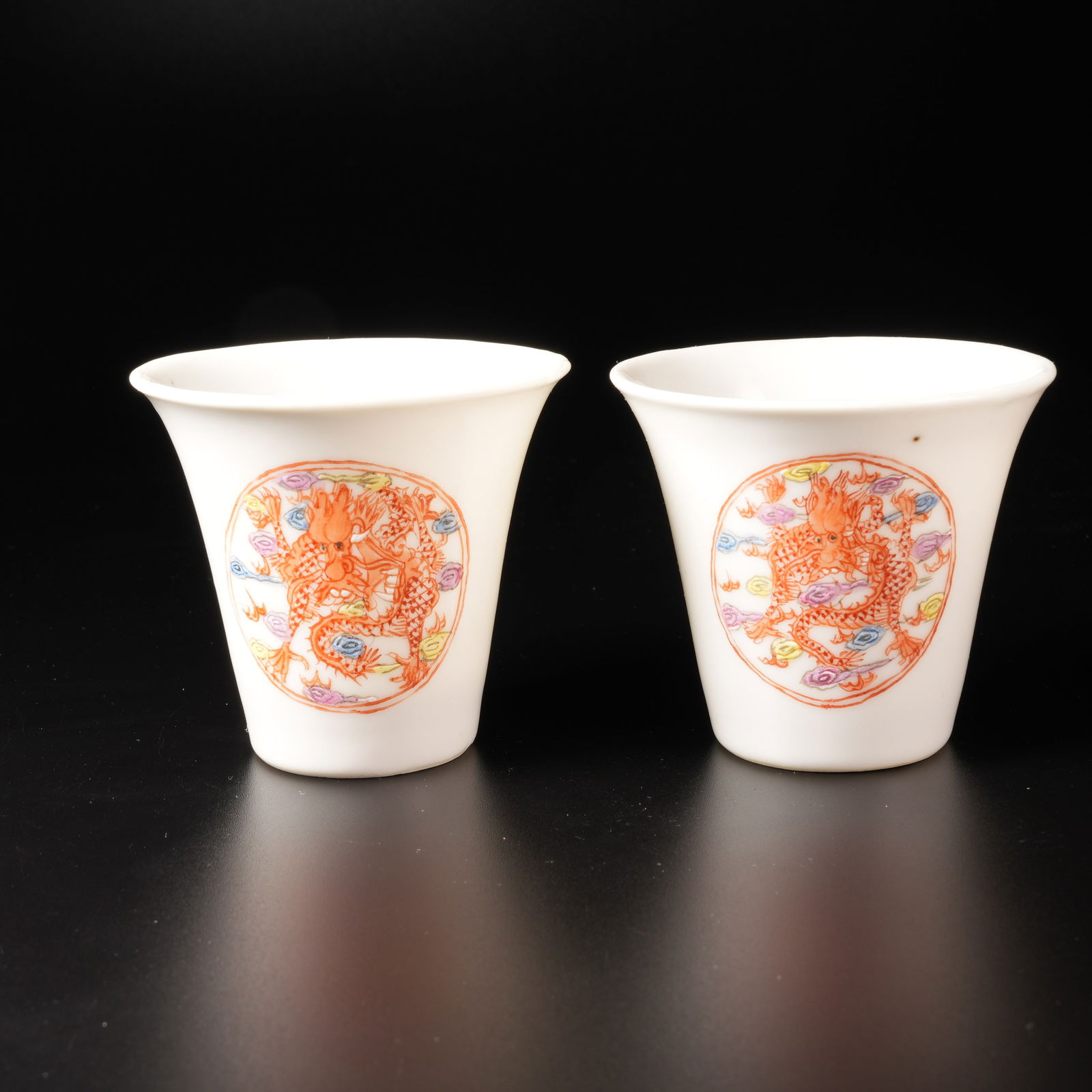 A ALUM-RED WUCAI CUPS WITH CLOUD-AND-DRAGON PATTERN (SET): Alum-Red Wucai Cups with Cloud-and-Dragon Pattern (Set)