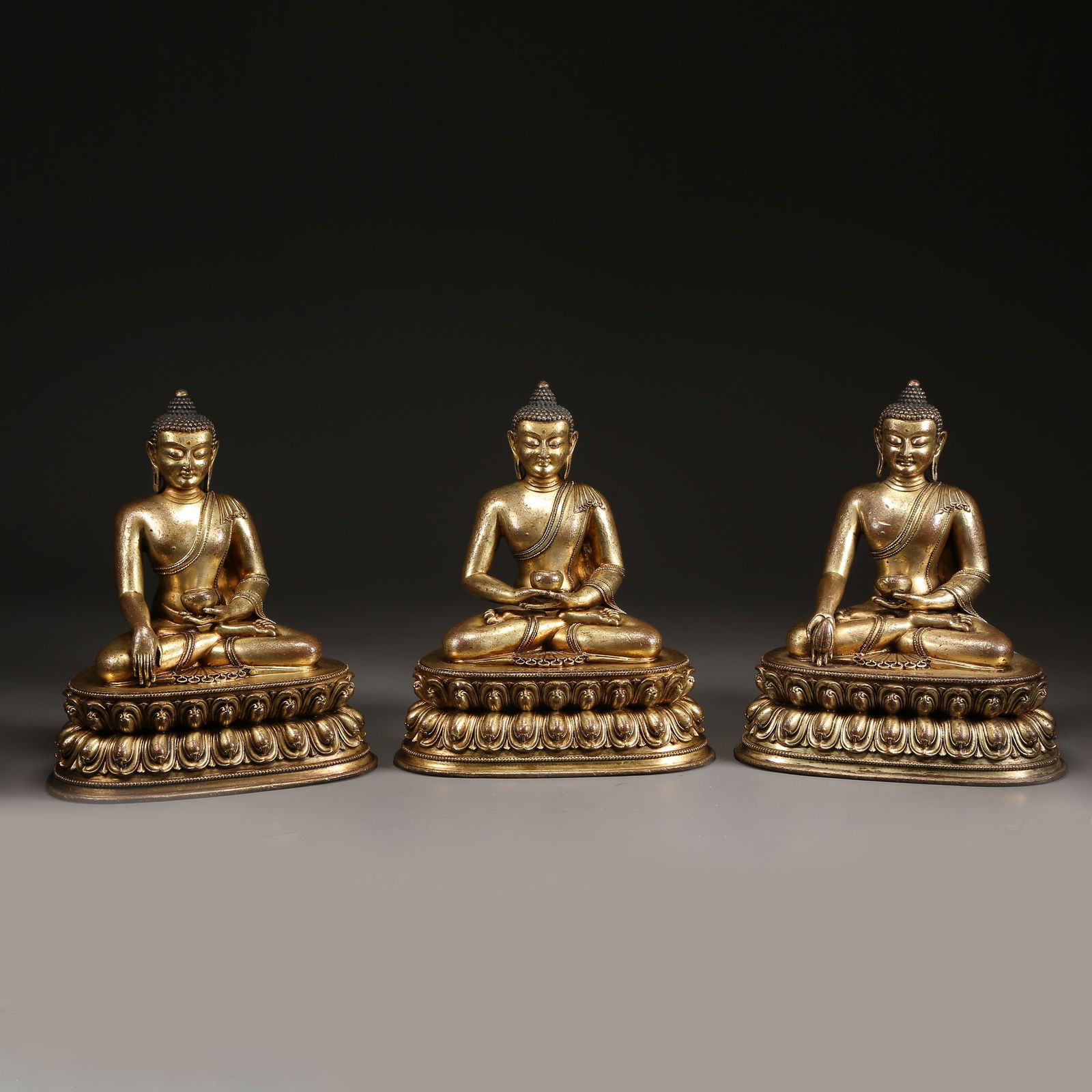 A SET OF GILT BRONZE BUDDHAS OF THE THREE AGES: Set of Gilt Bronze Buddhas of the Three Ages