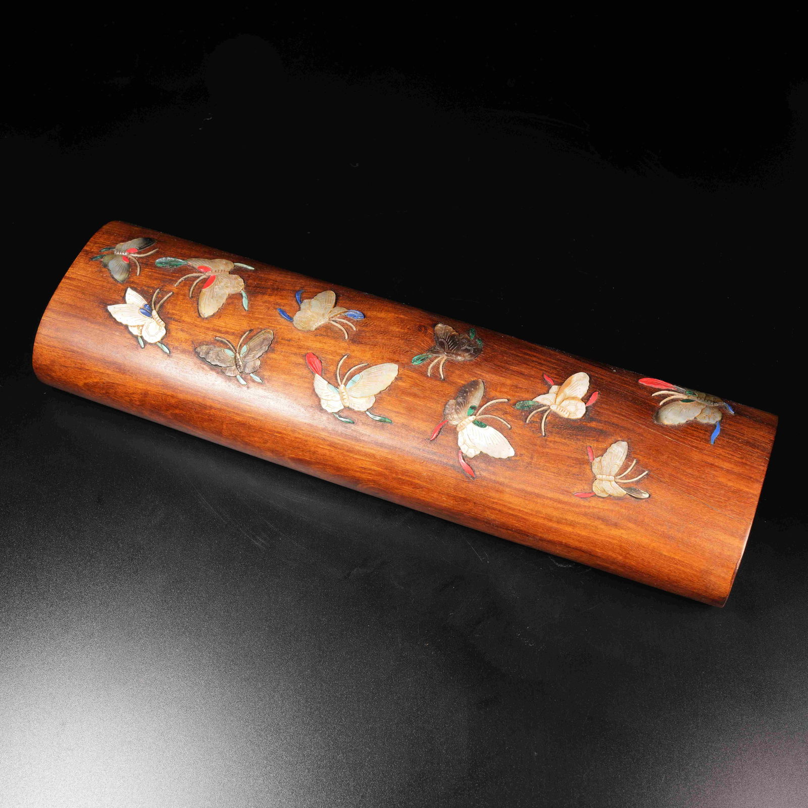 A HUANGHUALI WOOD PAPERWEIGHT INLAID WITH PRECIOUS MATERIALS AND HUNDRED-BUTTERFLY PATTERN: Huanghuali Wood Paperweight Inlaid with Precious Materials and Hundred-Butterfly Pattern