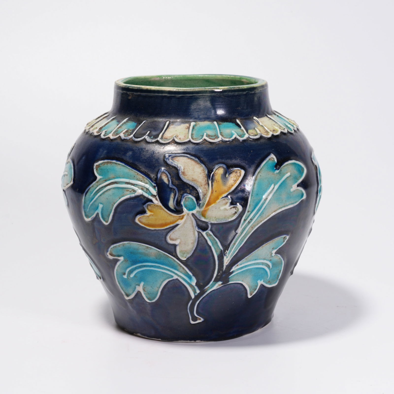 A BLUE-GLAZED JAR WITH FLOWER PATTERN: Blue-Glazed Jar with Flower Pattern