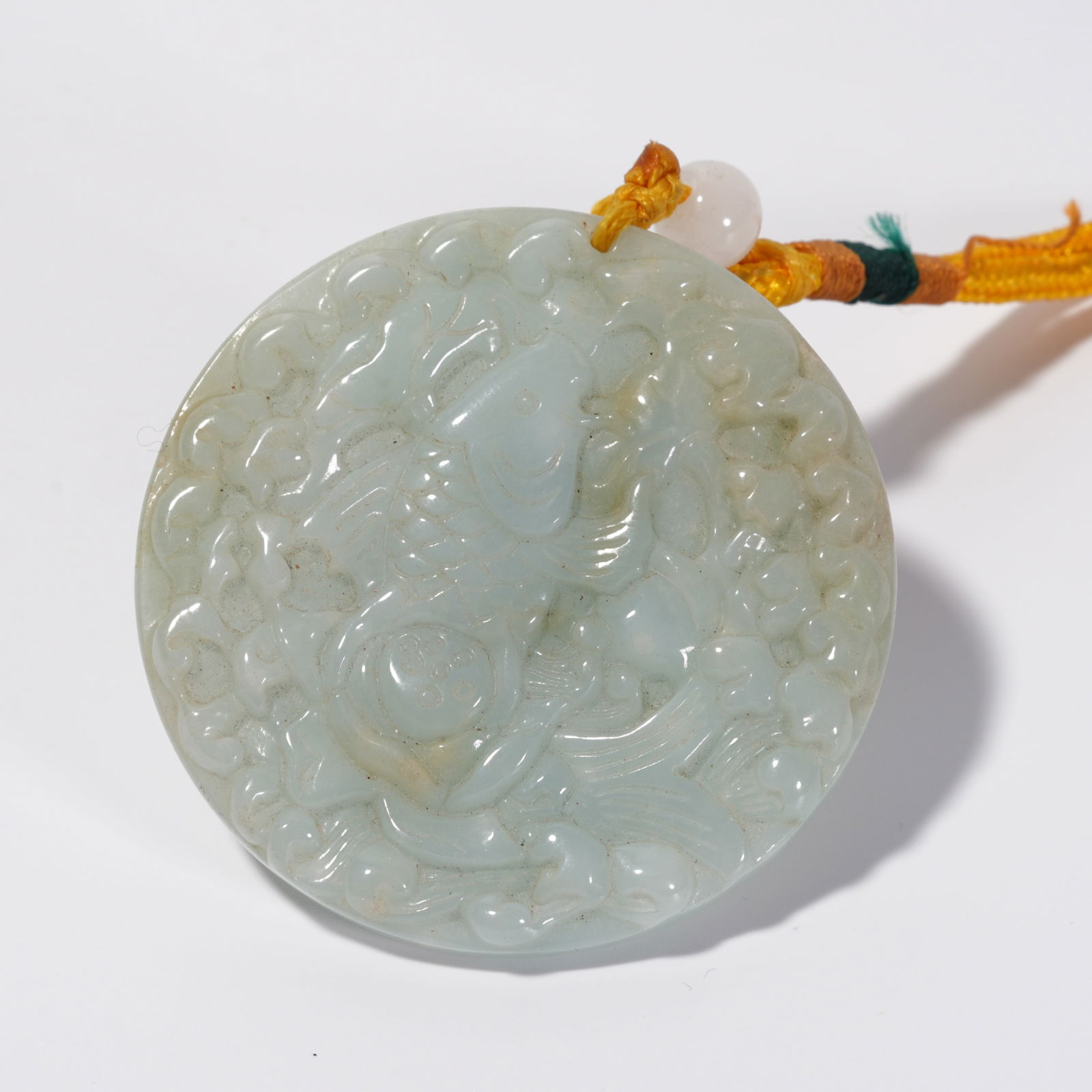 A JADEITE "ABUNDANCE YEAR AFTER YEAR" PENDANT (1 of 9)