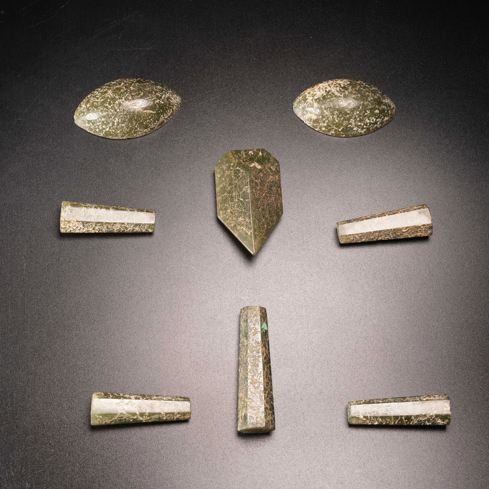 A COVERED-FACE PENDANT IN ARCHAIC JADE: Covered-Face Pendant in Archaic Jade