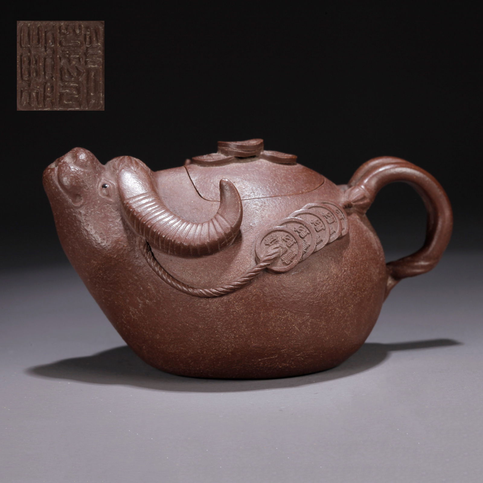 A PURPLE CLAY (ZISHA) OX-HEAD TEAPOT: Purple Clay (Zisha) Ox-Head Teapot