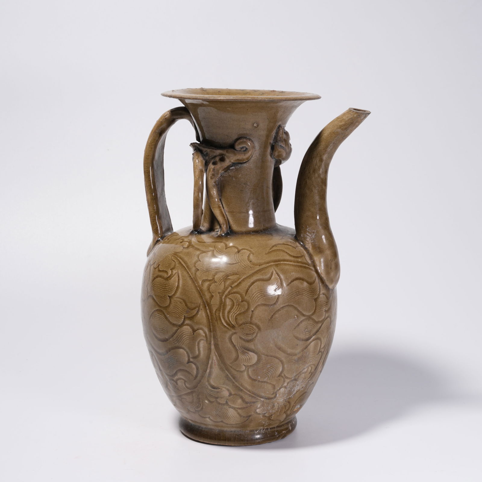 A YAOZHOU KILN FLOWER-PATTERN EWER: Yaozhou Kiln Flower-Pattern Ewer