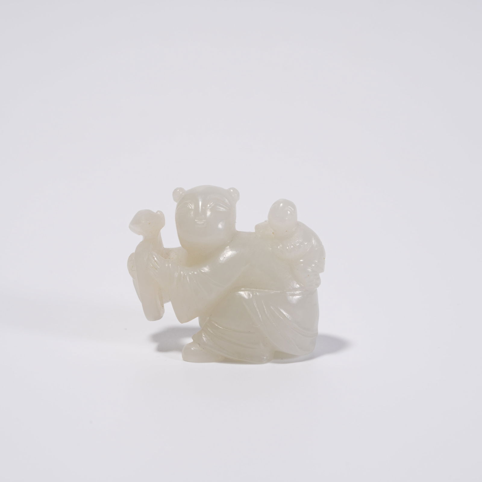 A HETIAN JADE CHILD FIGURE ORNAMENT: Hetian Jade Child Figure Ornament