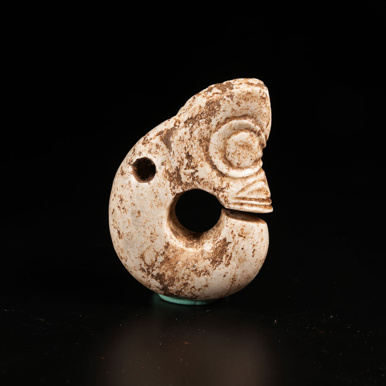 A PIG-DRAGON PENDANT IN ARCHAIC JADE: Pig-Dragon Pendant in Archaic Jade