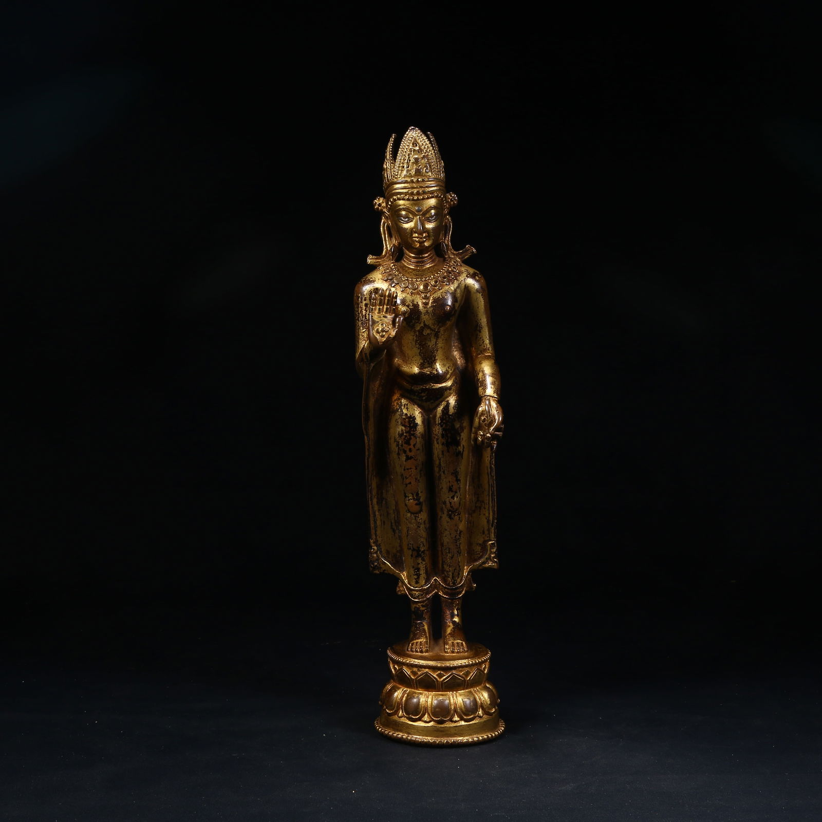A GILT BRONZE STANDING SHAKYAMUNI BUDDHA: Gilt Bronze Standing Shakyamuni Buddha