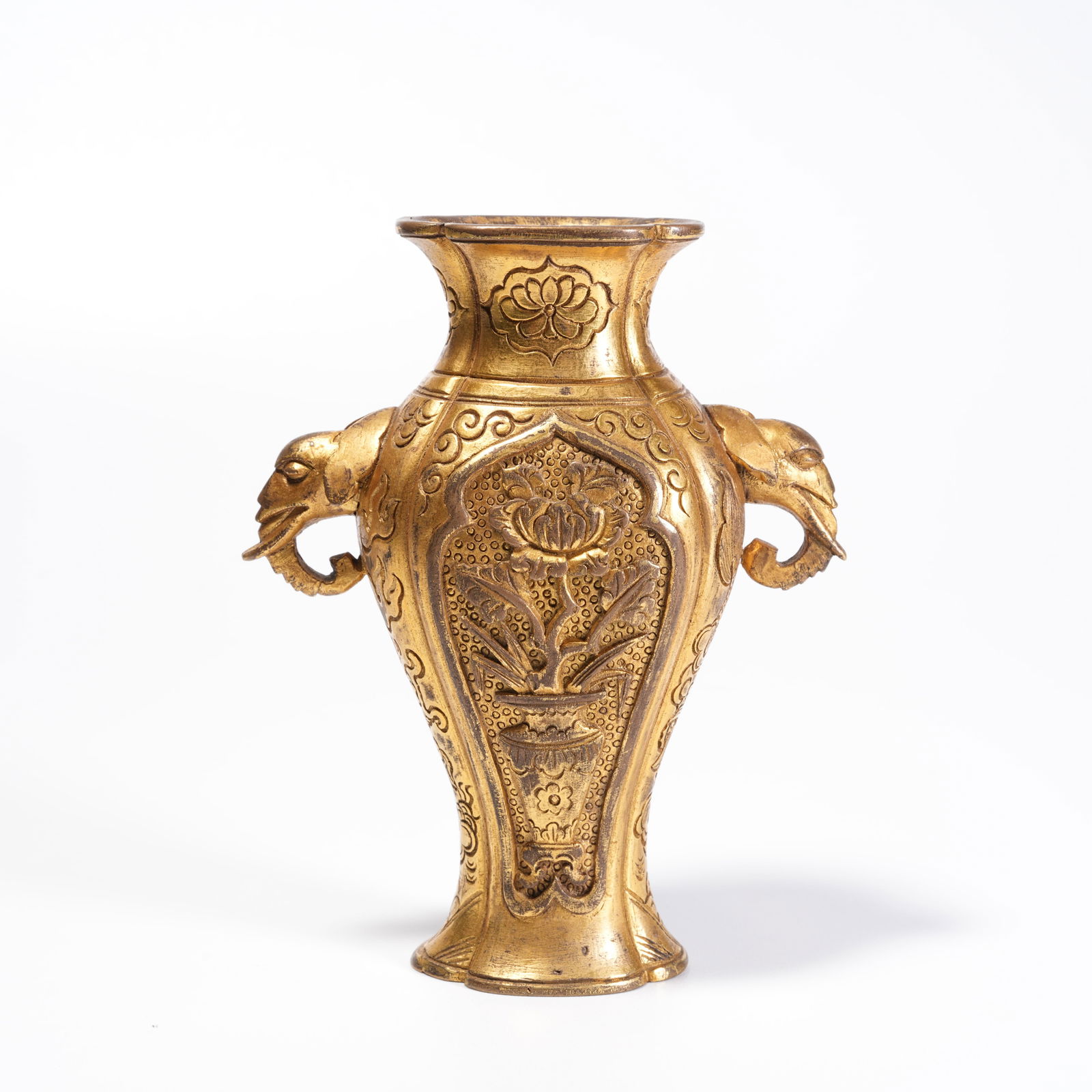 A GILDED BRONZE VASE WITH FLOWER PATTERN AND DOUBLE ELEPHANT HANDLES: Gilded Bronze Vase with Flower Pattern and Double Elephant Handles