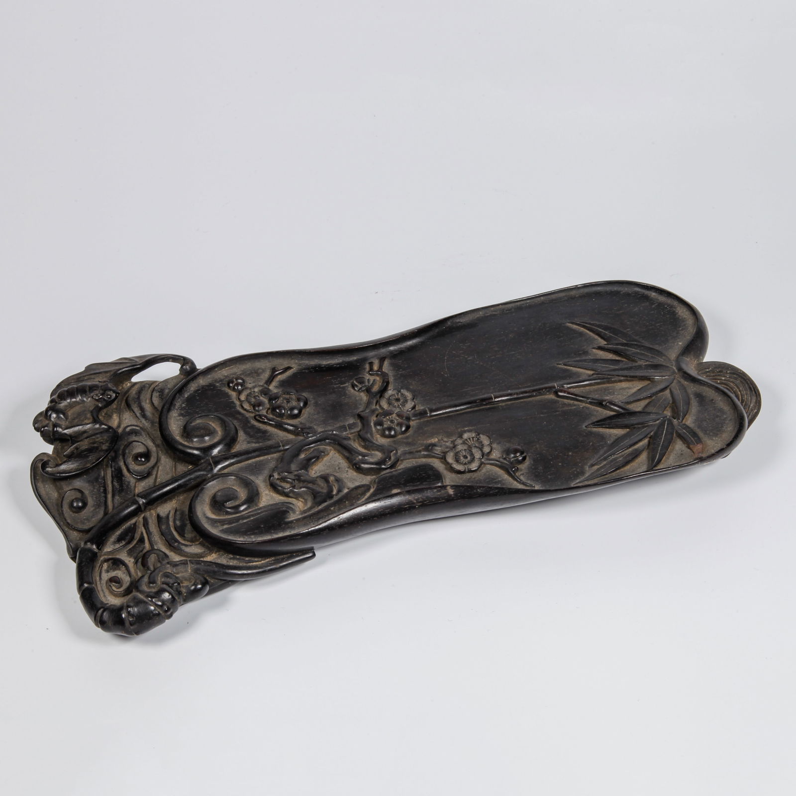 A ZITAN WOOD CARVED PLUM BLOSSOM PATTERN BRUSH LICKER: Zitan Wood Carved Plum Blossom Pattern Brush Licker