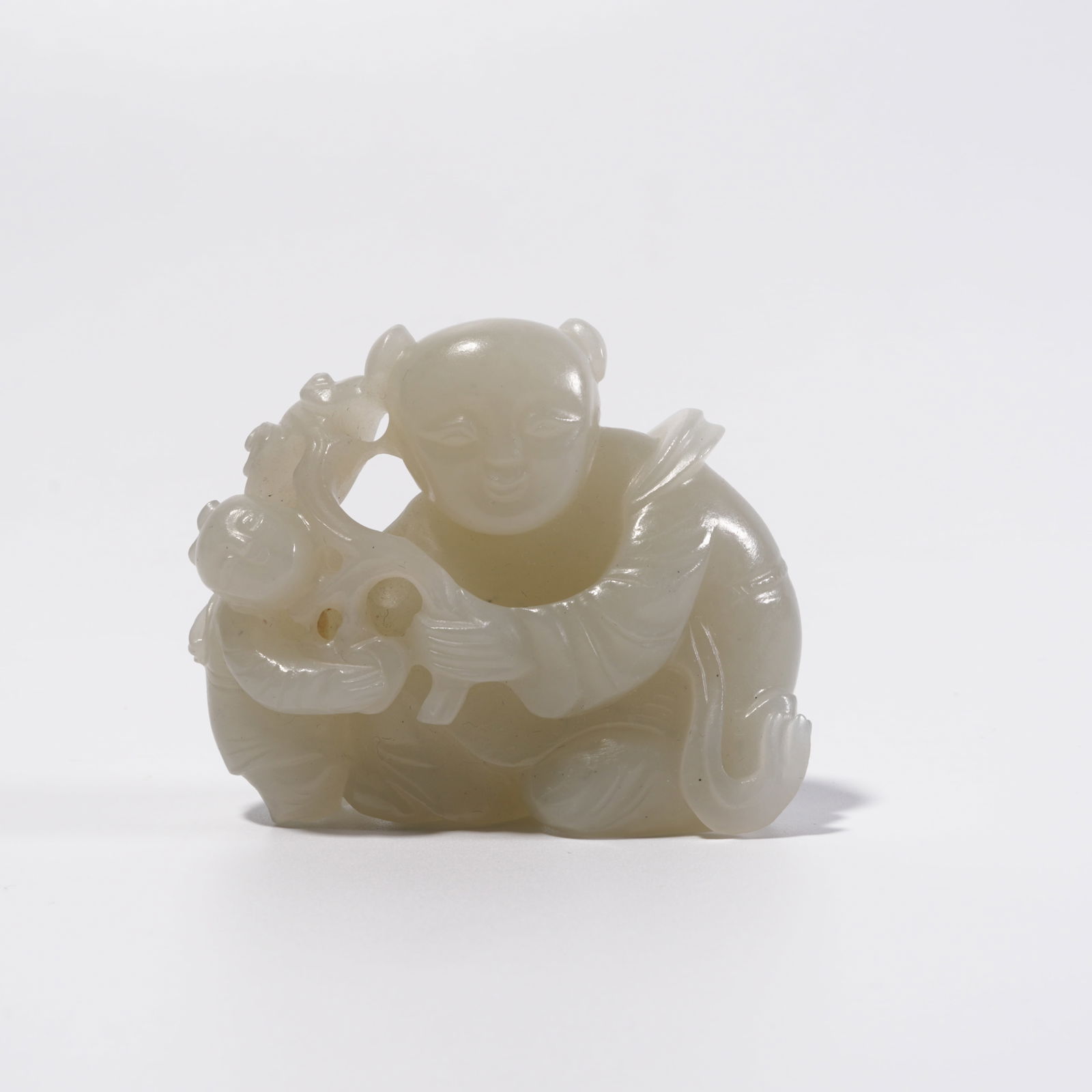A HETIAN JADE CHILD BLESSING ORNAMENT: Hetian Jade Child Blessing Ornament