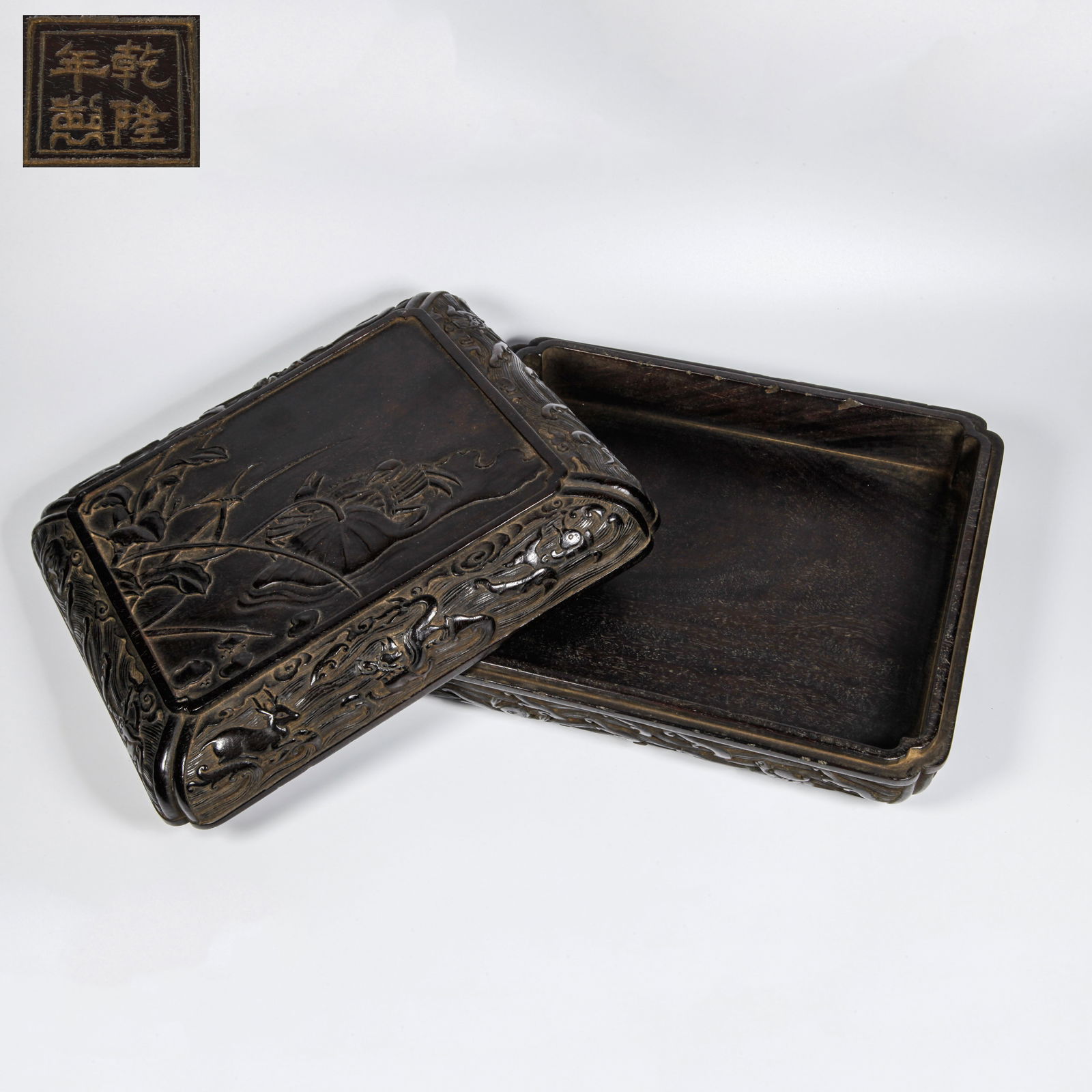 A ZITAN WOOD CARVED LOTUS PATTERN COVERED BOX: Zitan Wood Carved Lotus Pattern Covered Box