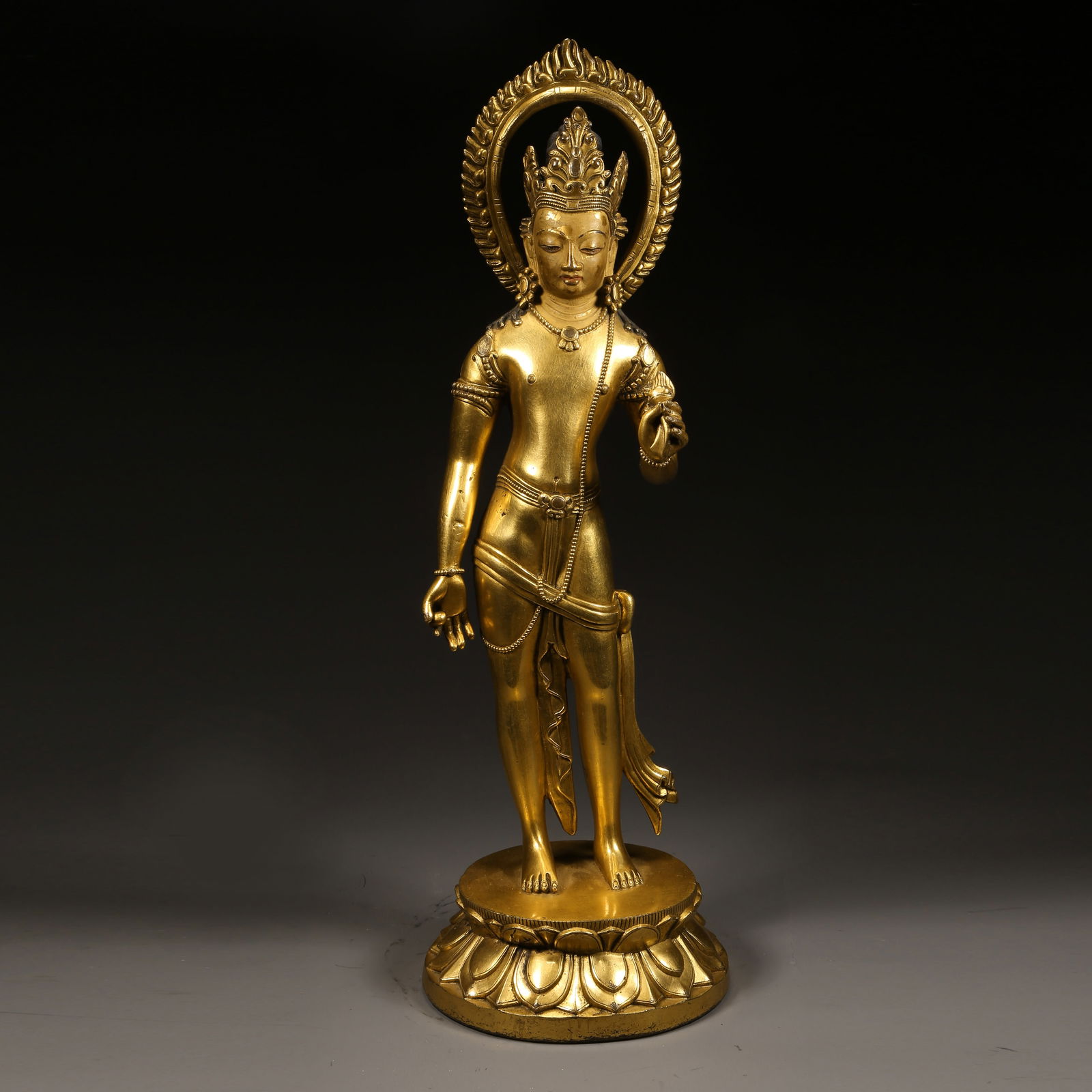 A GILDED BRONZE STANDING BODHISATTVA: Gilded bronze standing Bodhisattva