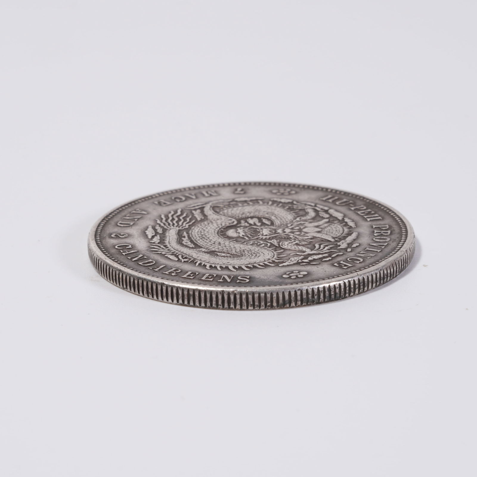 A SILVER DOLLAR COIN - 4