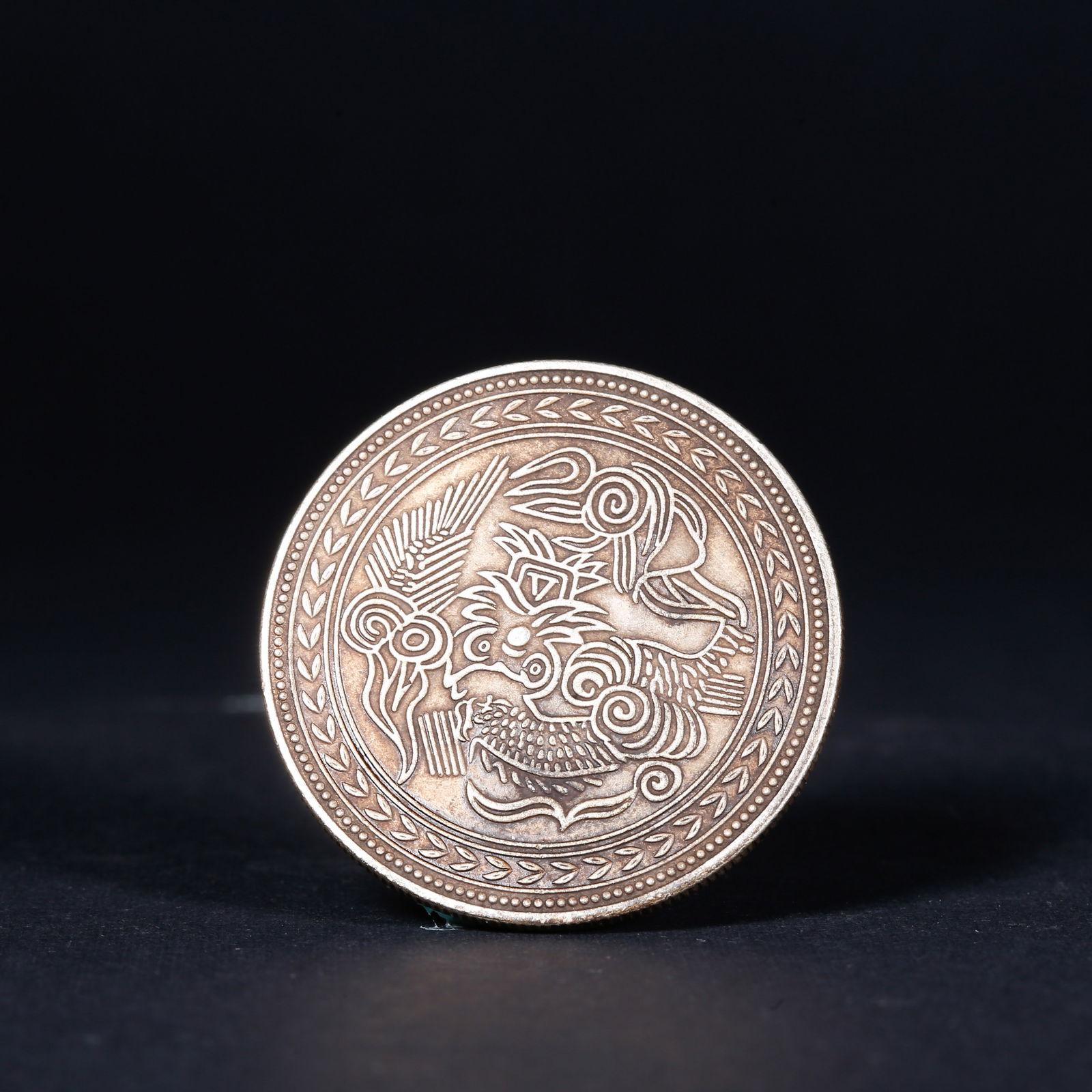A SILVER DOLLAR COIN - 2