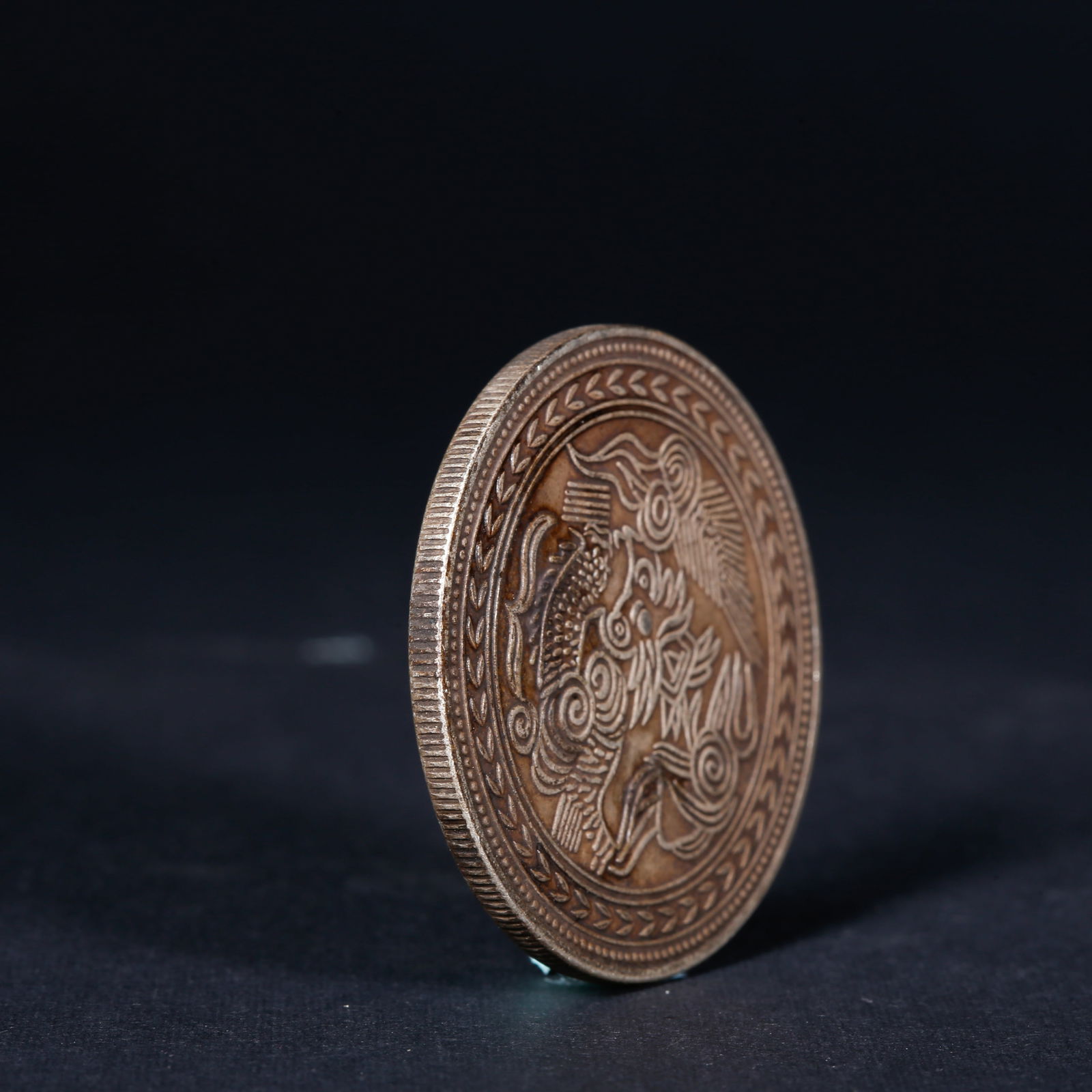 A SILVER DOLLAR COIN - 3