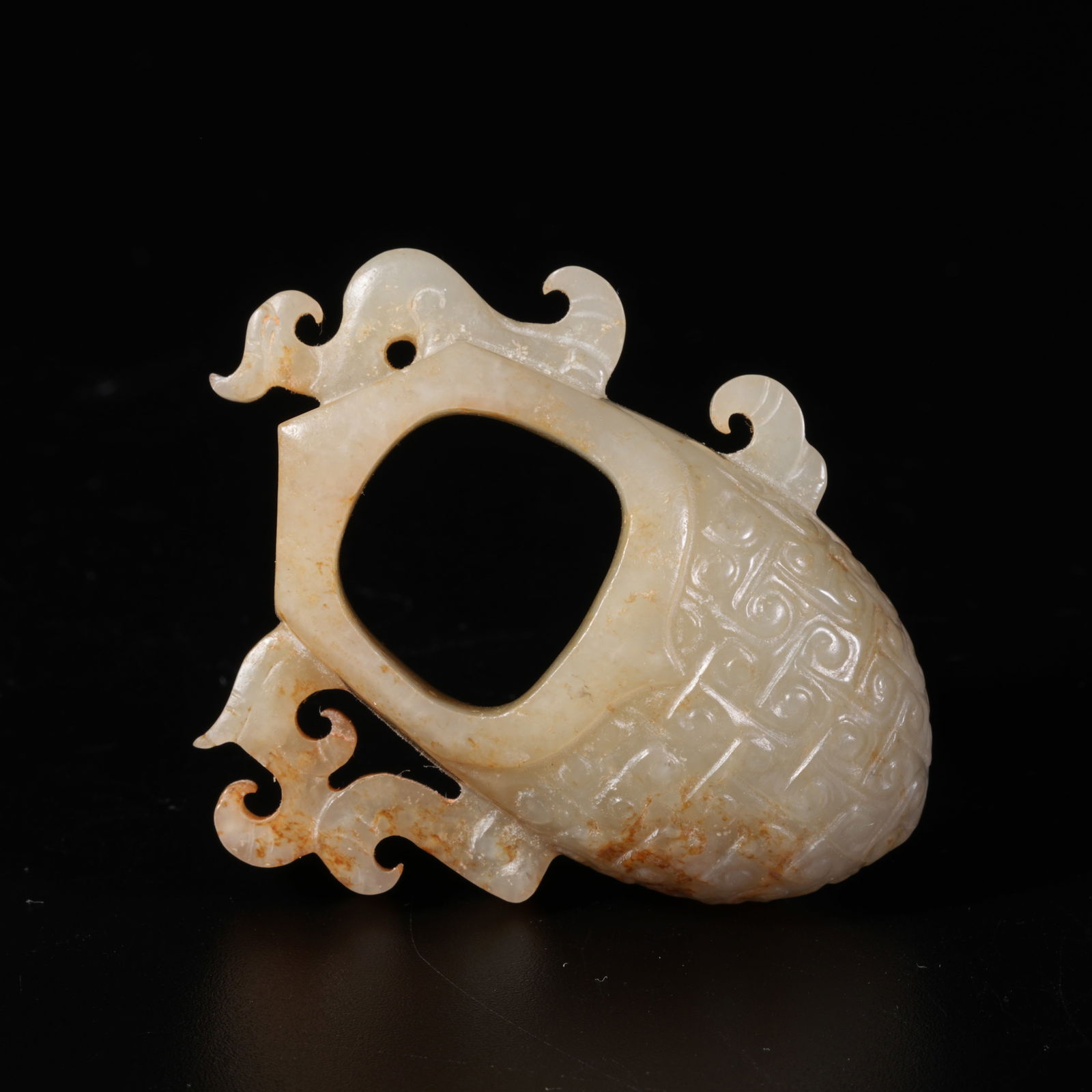A HETIAN JADE CHICKEN-HEART PENDANT: Hetian Jade Chicken-Heart Pendant