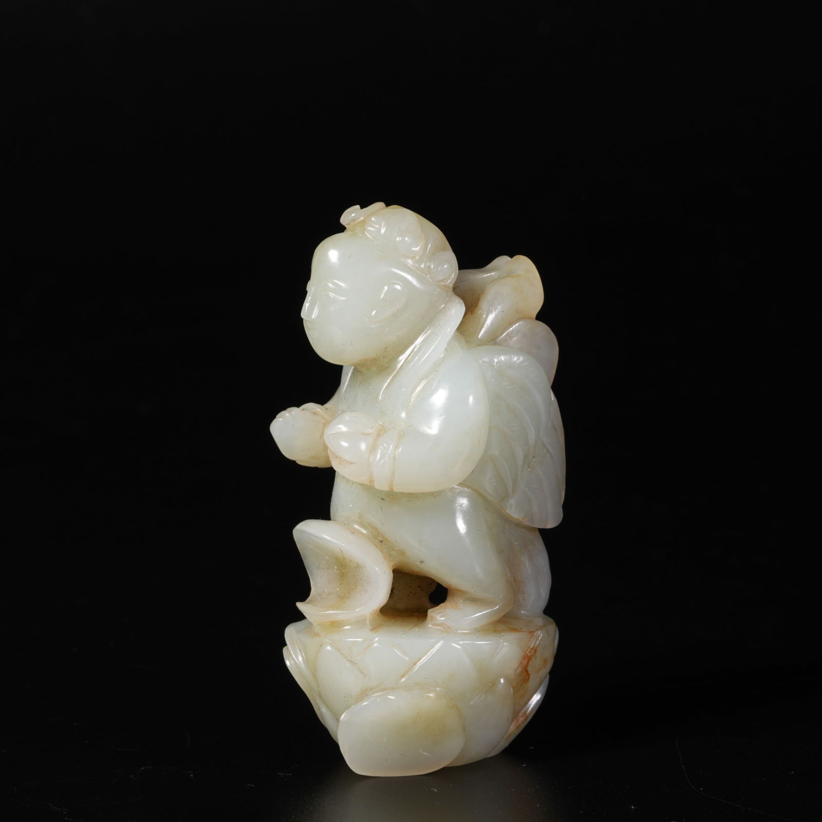 A HETIAN JADE FEATHERED IMMORTAL ORNAMENT (1 of 10)