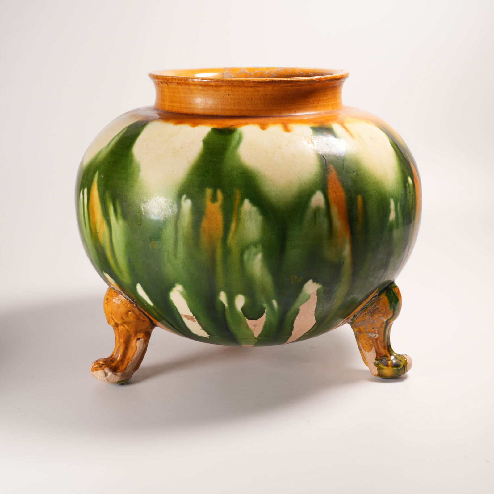 A TANG SANCAI THREE-FOOTED JAR: Tang Sancai Three-Footed Jar