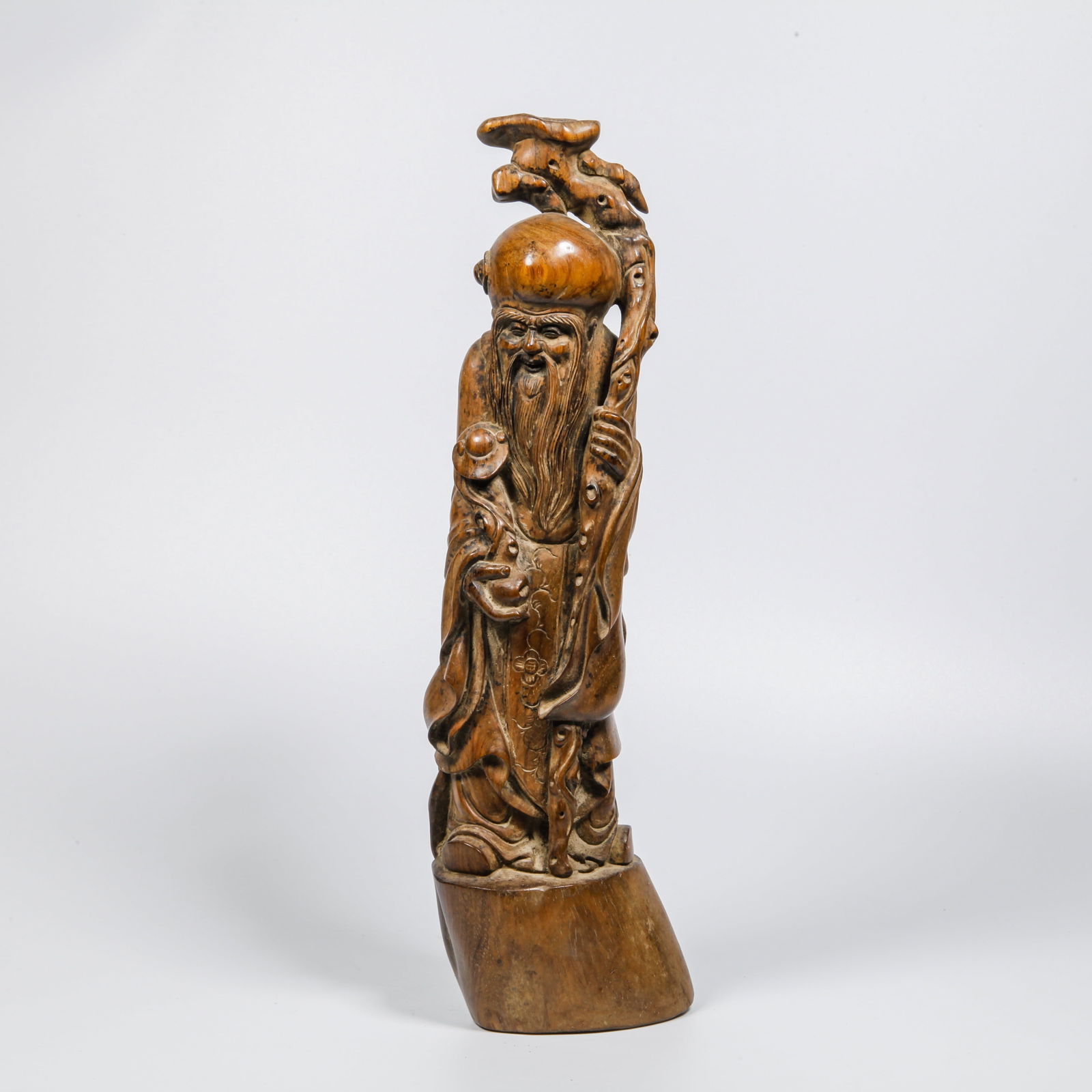 A HUANGHUALI WOOD CARVED LONGEVITY STAR ORNAMENT: Huanghuali Wood Carved Longevity Star Ornament