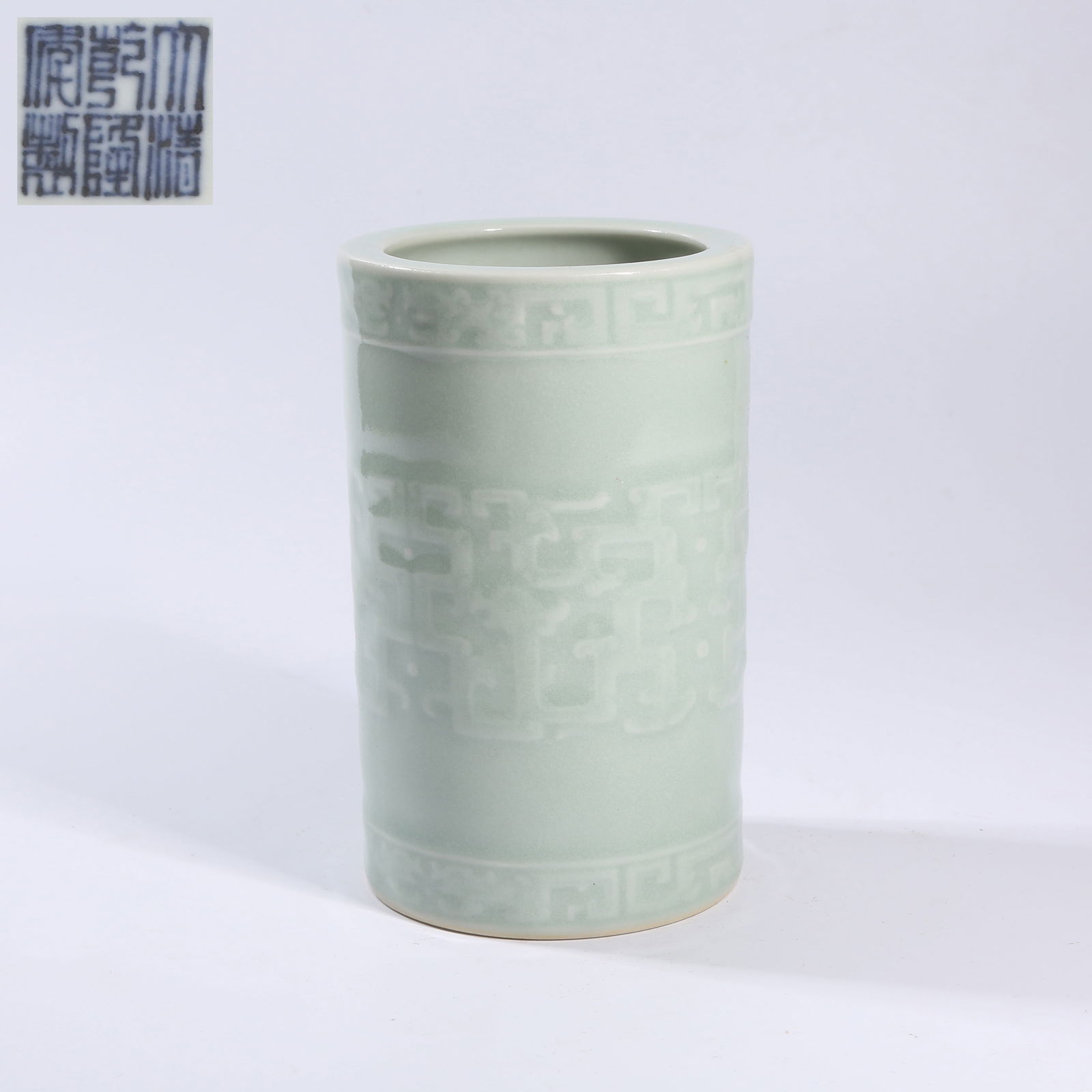 A TIANQING-GLAZED INCISED TAOTIE-PATTERN BRUSH POT: Tianqing-glazed incised taotie-pattern brush pot